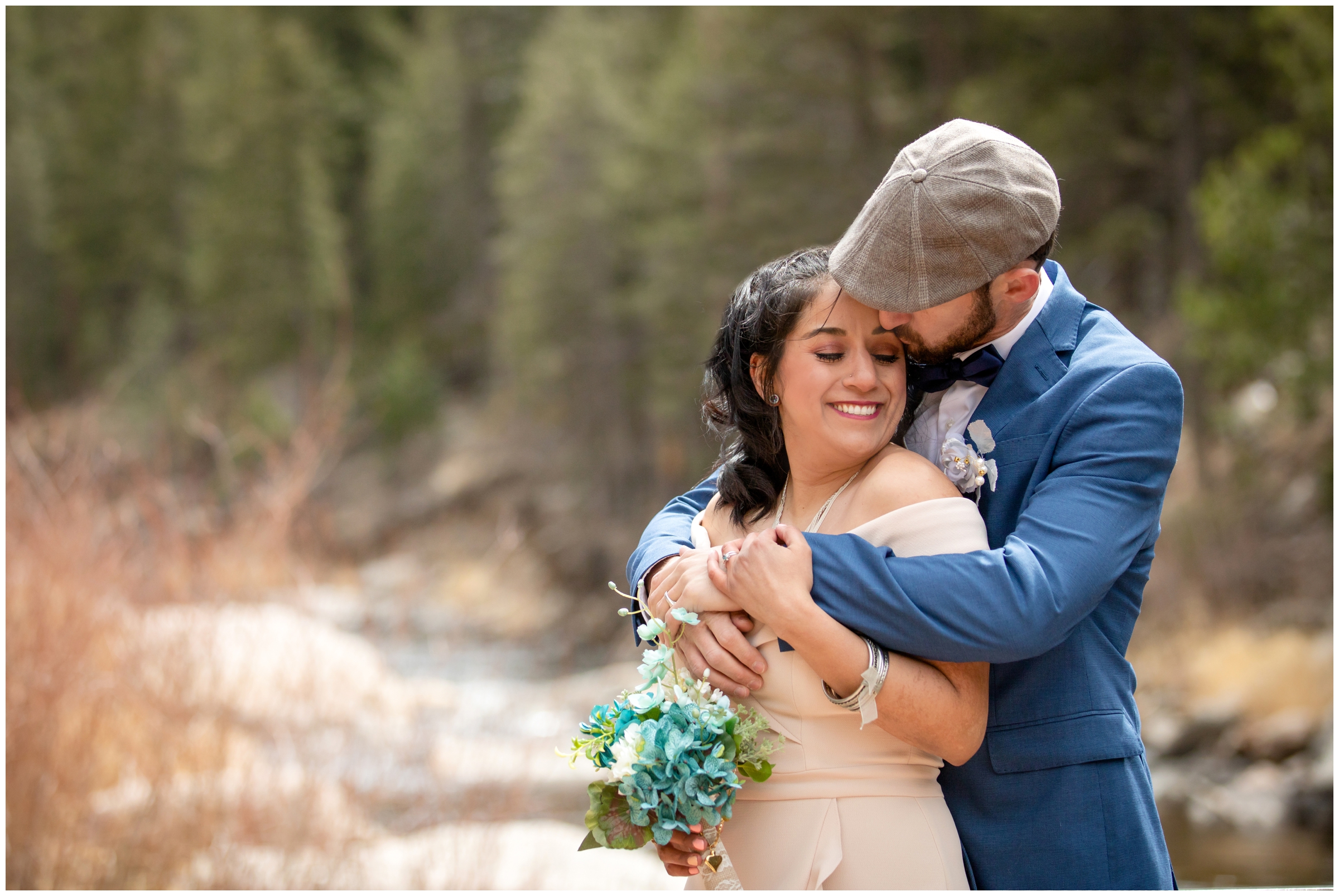 couple cuddling next to Big Thompson River during intimate elopement wedding pictures in Loveland Colorado 