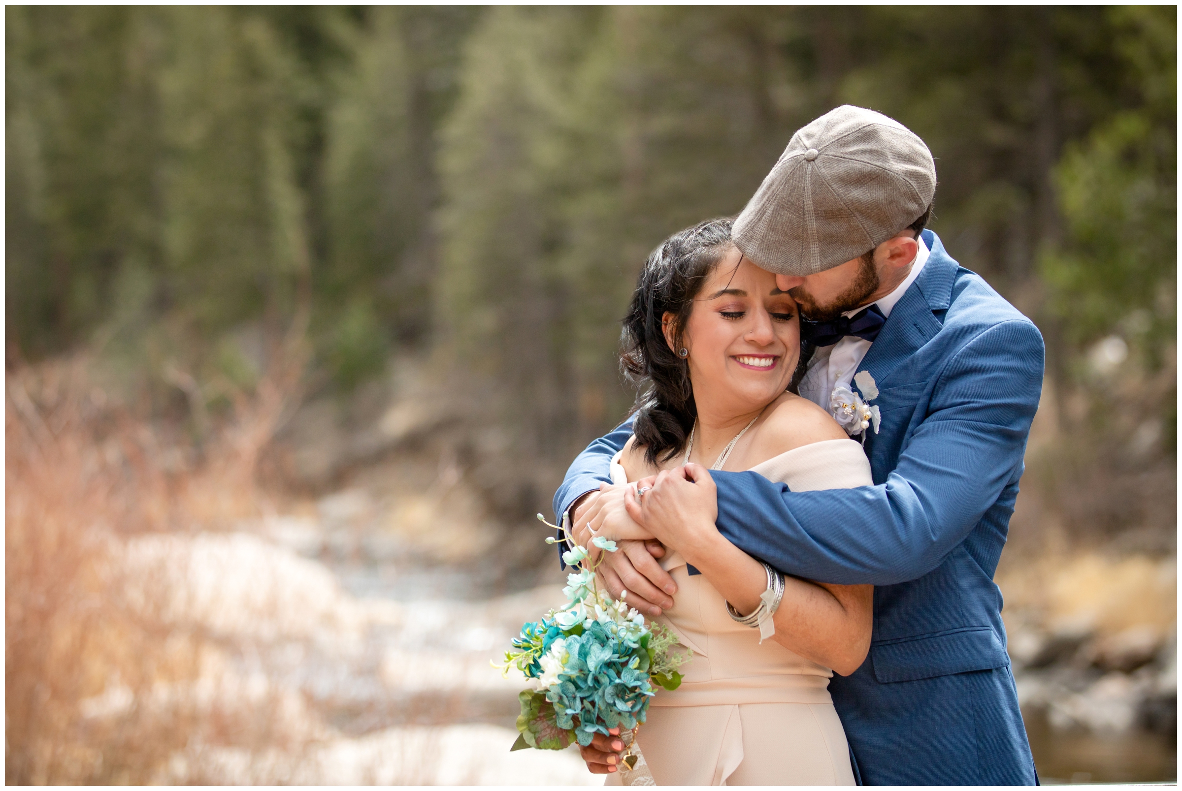 couple cuddling next to Big Thompson River during intimate elopement wedding pictures in Loveland Colorado