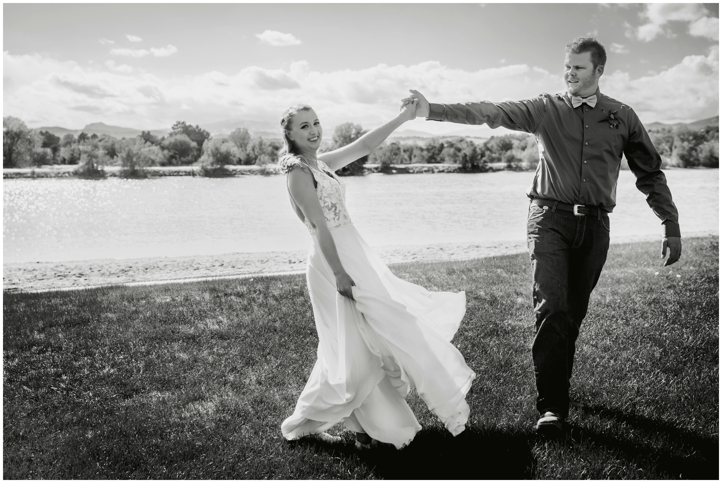 groom spinning bride during lake wedding pictures in Loveland Colorado 