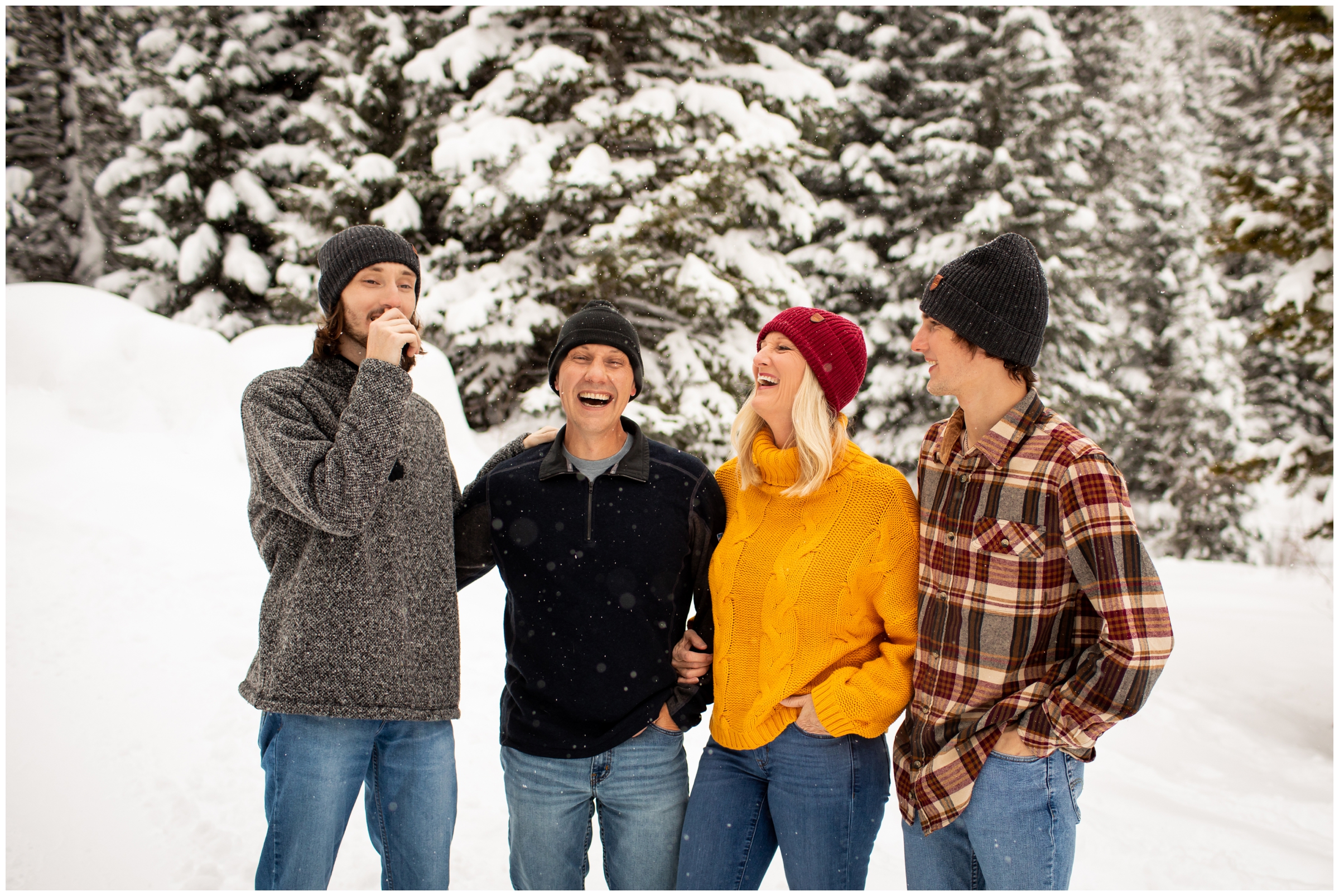 candid family photos in the snow in Winter Park Colorado