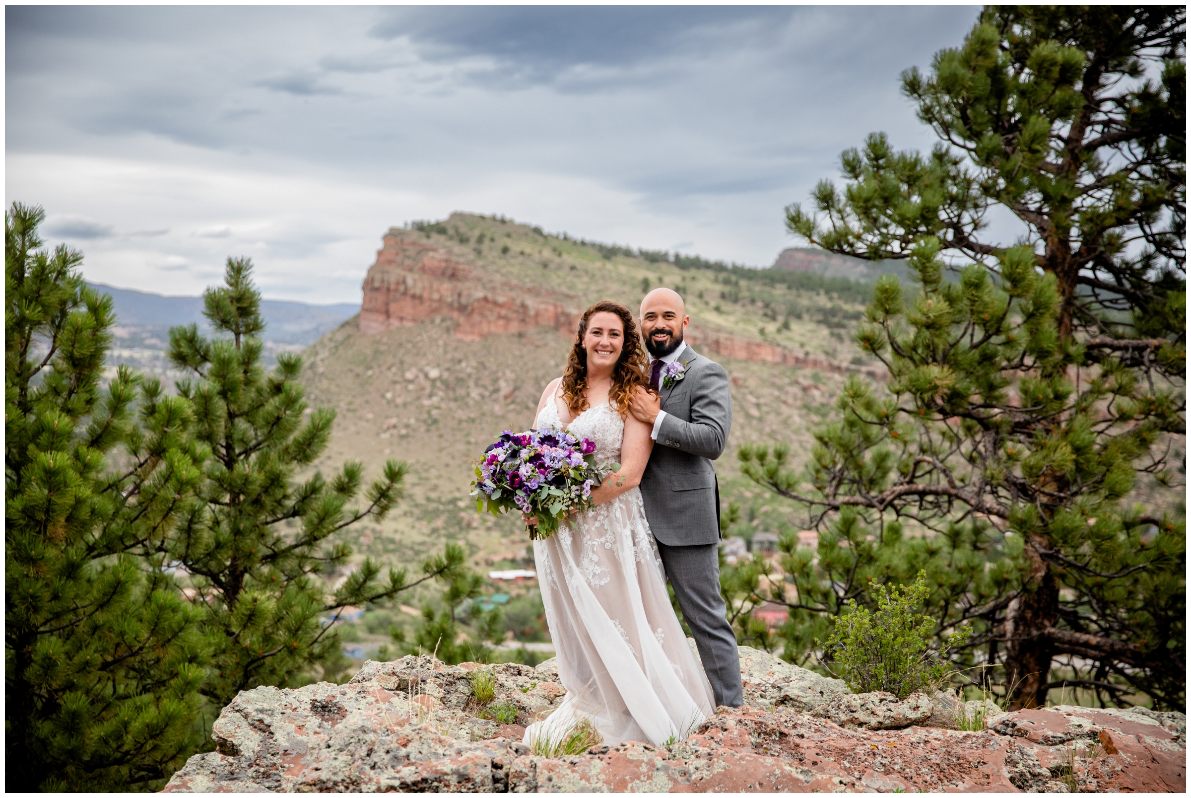 couple posing on rock formations during spring Colorado mountain wedding pictures at Lionscrest Manor