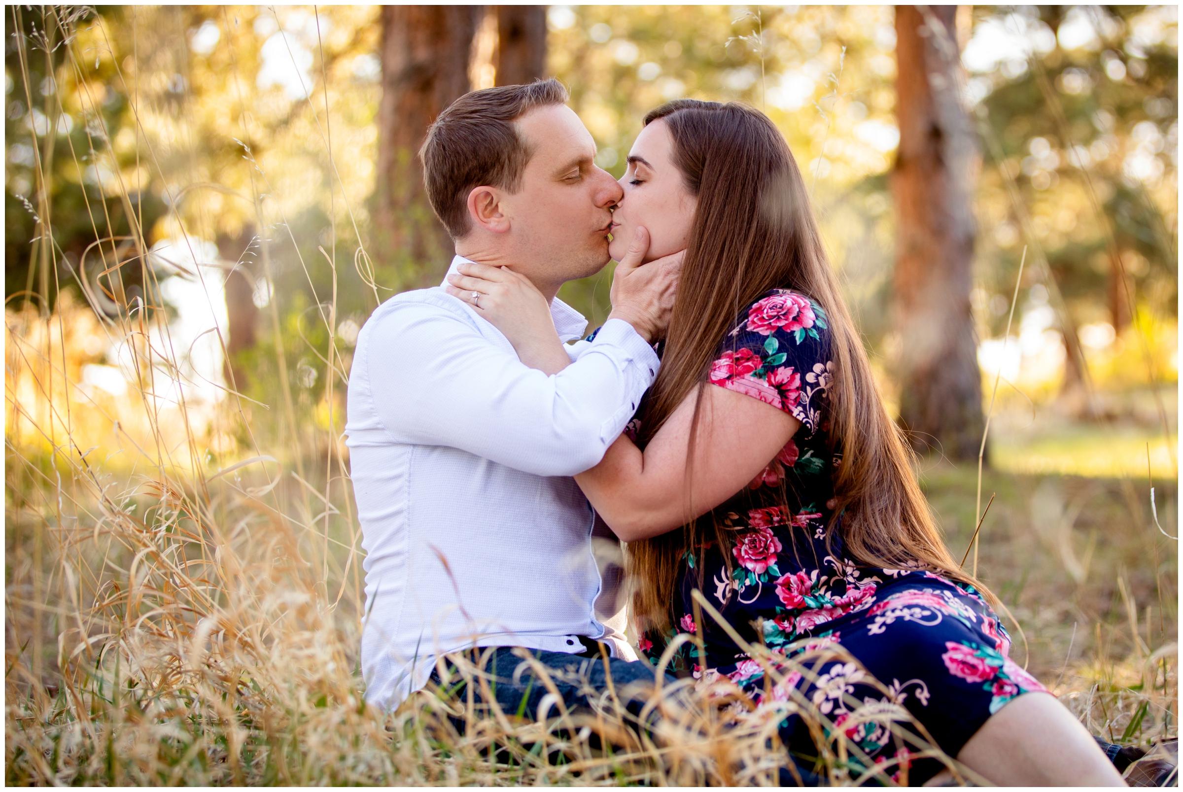 couple kissing in the forest during Colorado mountain engagement pictures at Mount Falcon West