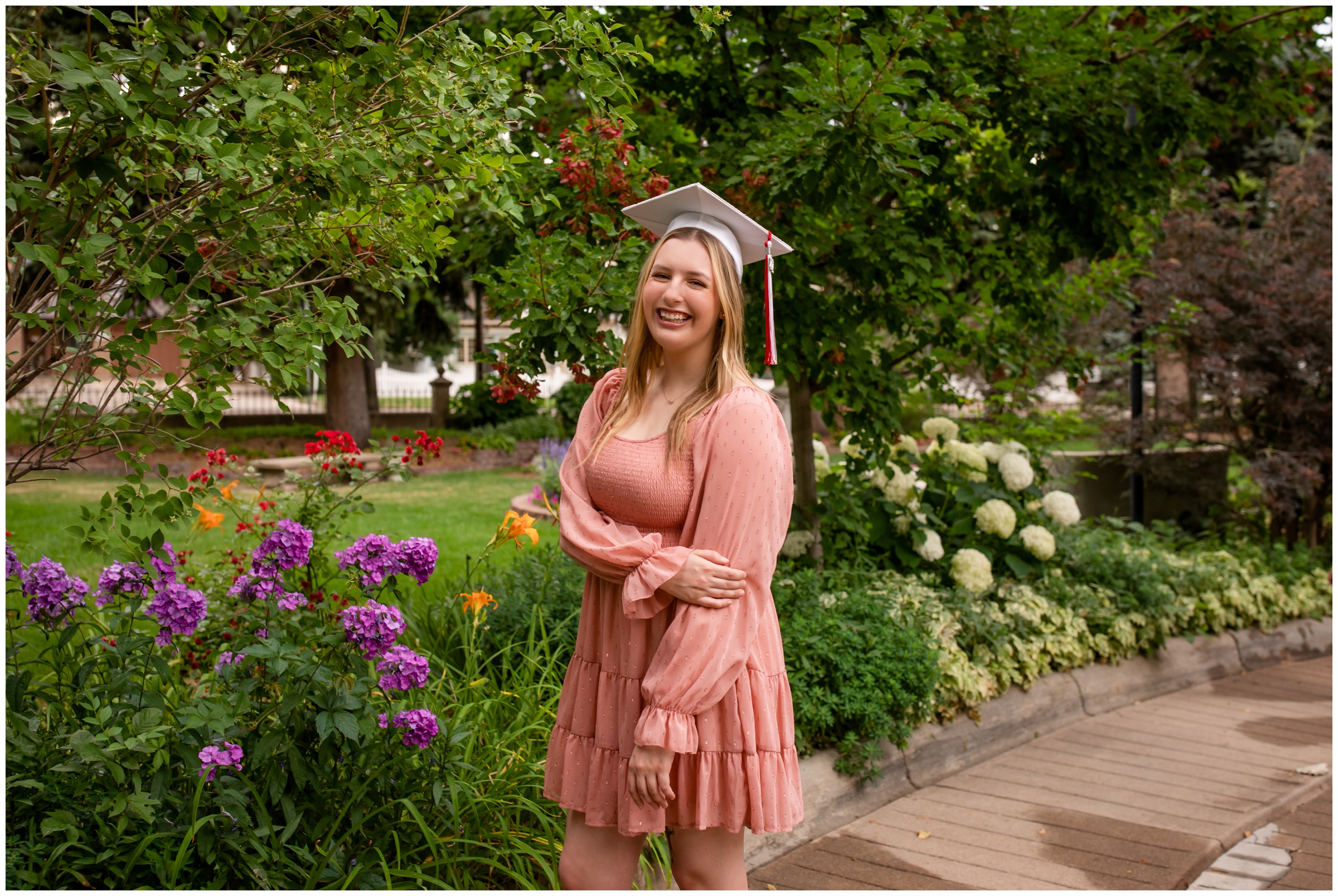 Brighton High School Colorado senior pictures in cap and gown at Callahan House in Longmont 