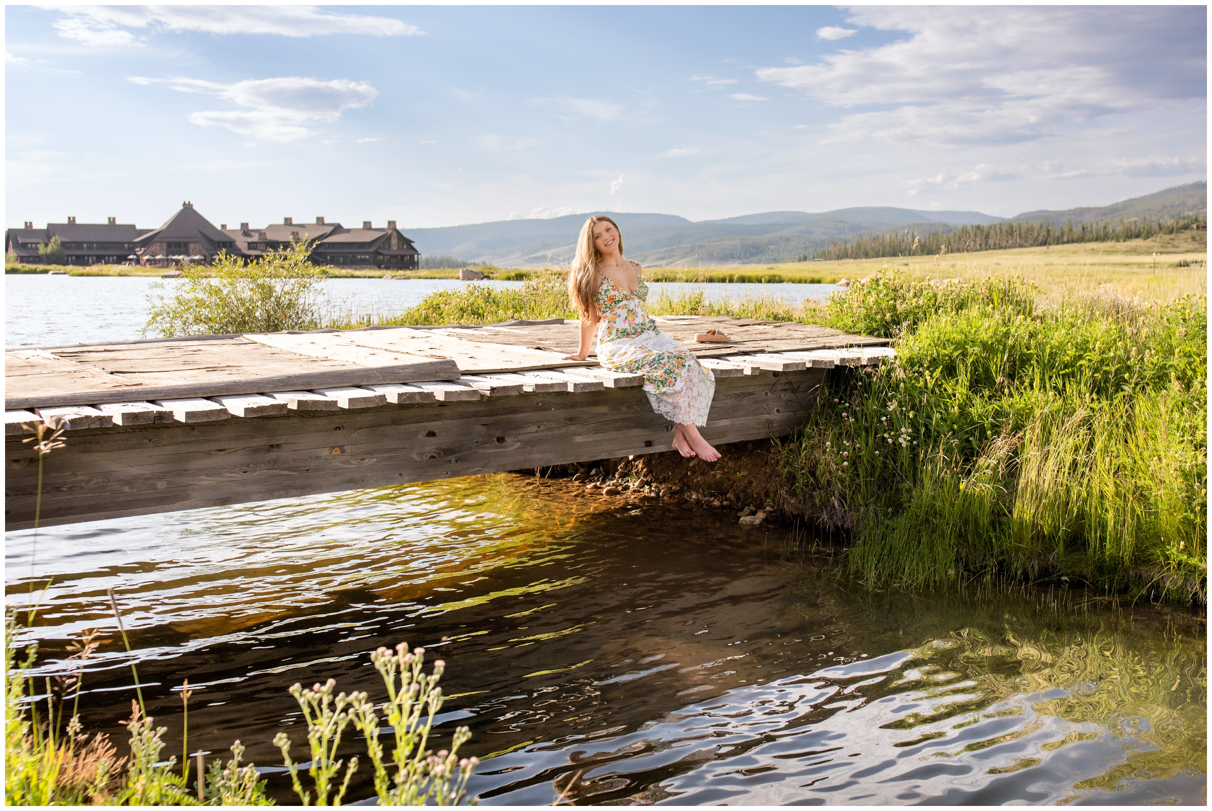 teen girl sitting on a wooden bridge during mountain senior pictures in Winter Park Colorado  
