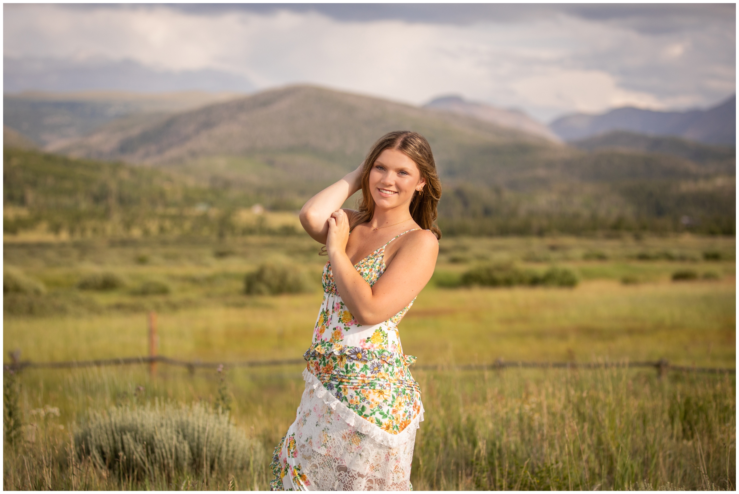 teen posing in a field during Colorado mountain senior photography session at Devil's Thumb Ranch by Winter Park portrait photographer Plum Pretty Photography
