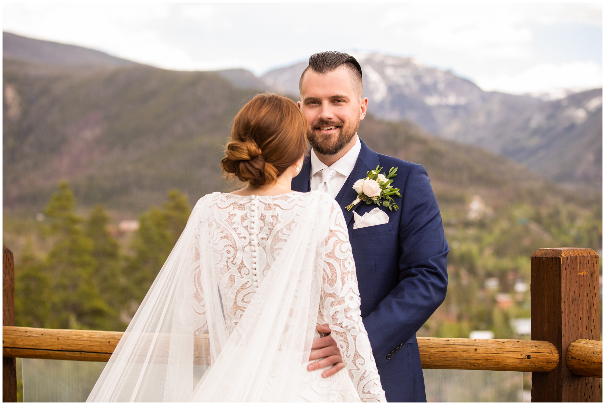 colorado mountain groom  in navy blue suit posing for portraits in Grand County 