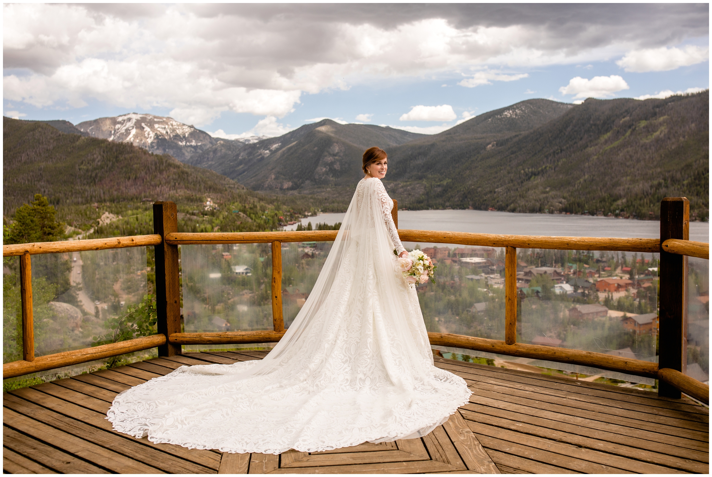 bride with long train and bridal cape posing for mountain portraits at Grand Lake Lodge wedding 