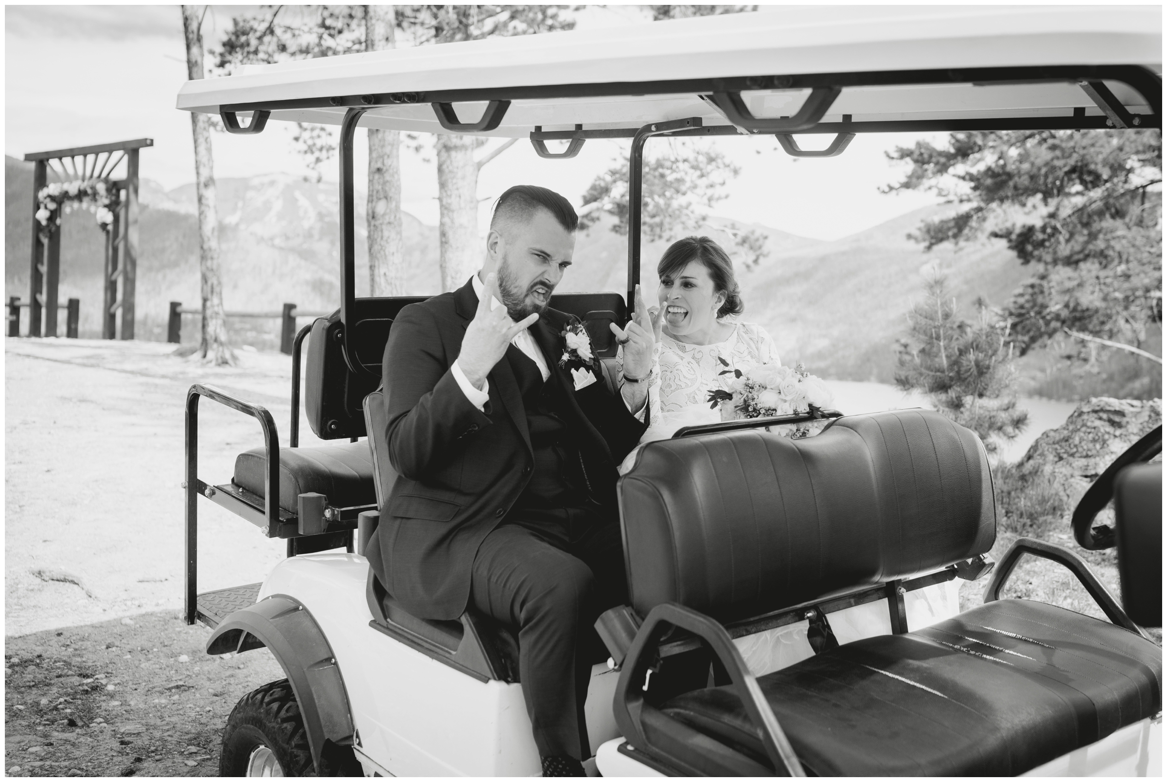 bride and groom riding in golf cart during Colorado mountain wedding