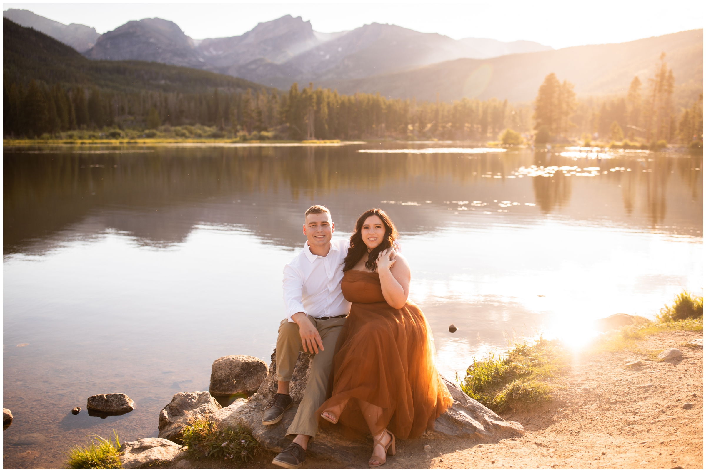 couple sitting on a rock during Estes Park engagement photography session in Rocky Mountain National Park 