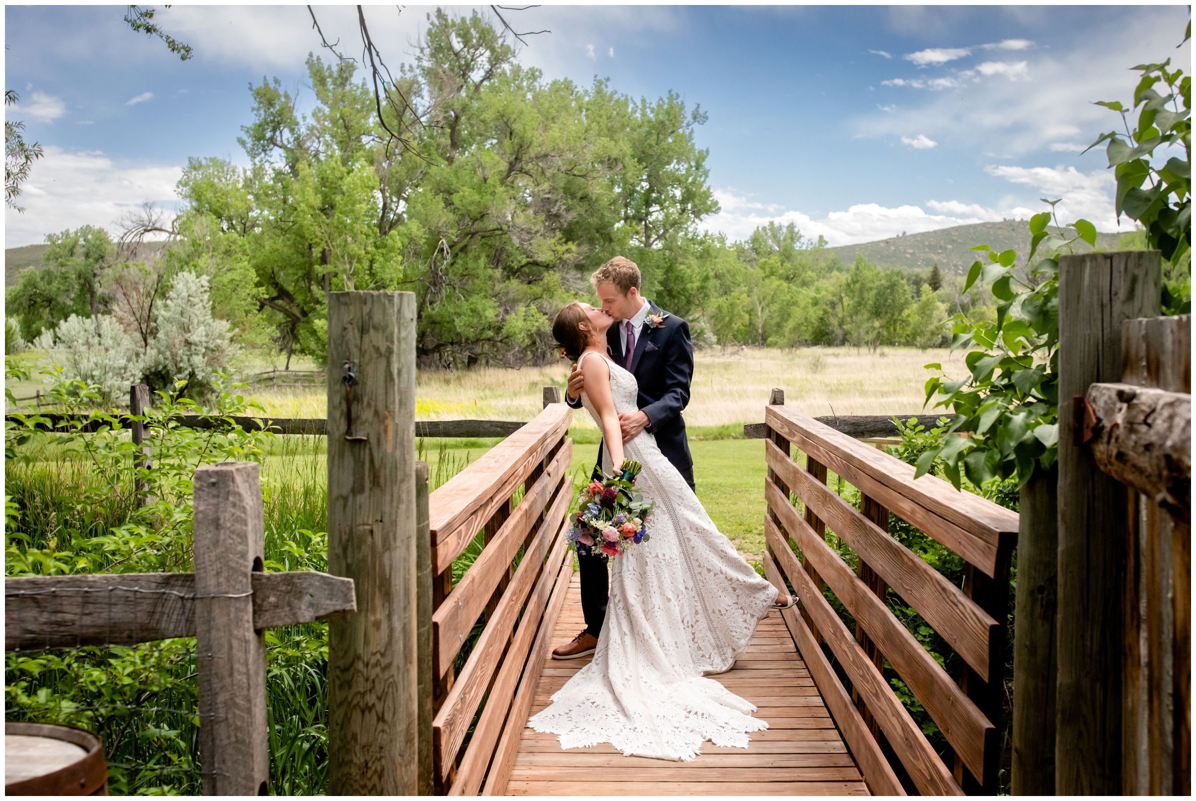 groom dipping bride on wooden bridge during summer wedding at Rist Canyon Inn in Fort Collins Colorado 