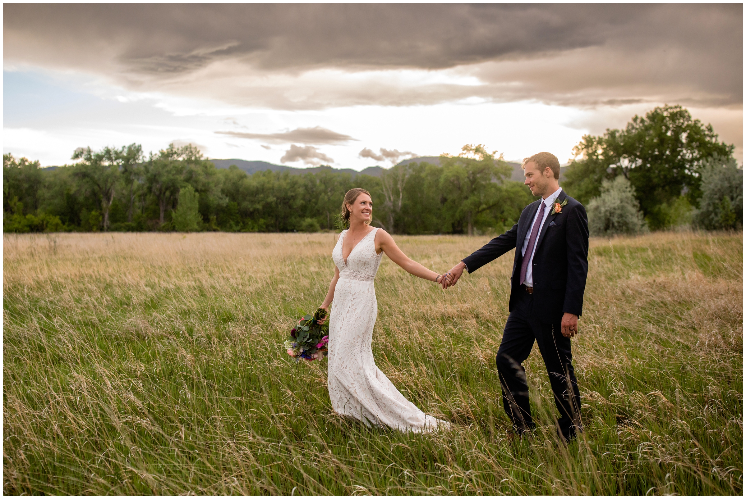 couple walking through a field at sunset during Rist Canyon Inn wedding pictures by Plum Pretty Photography 