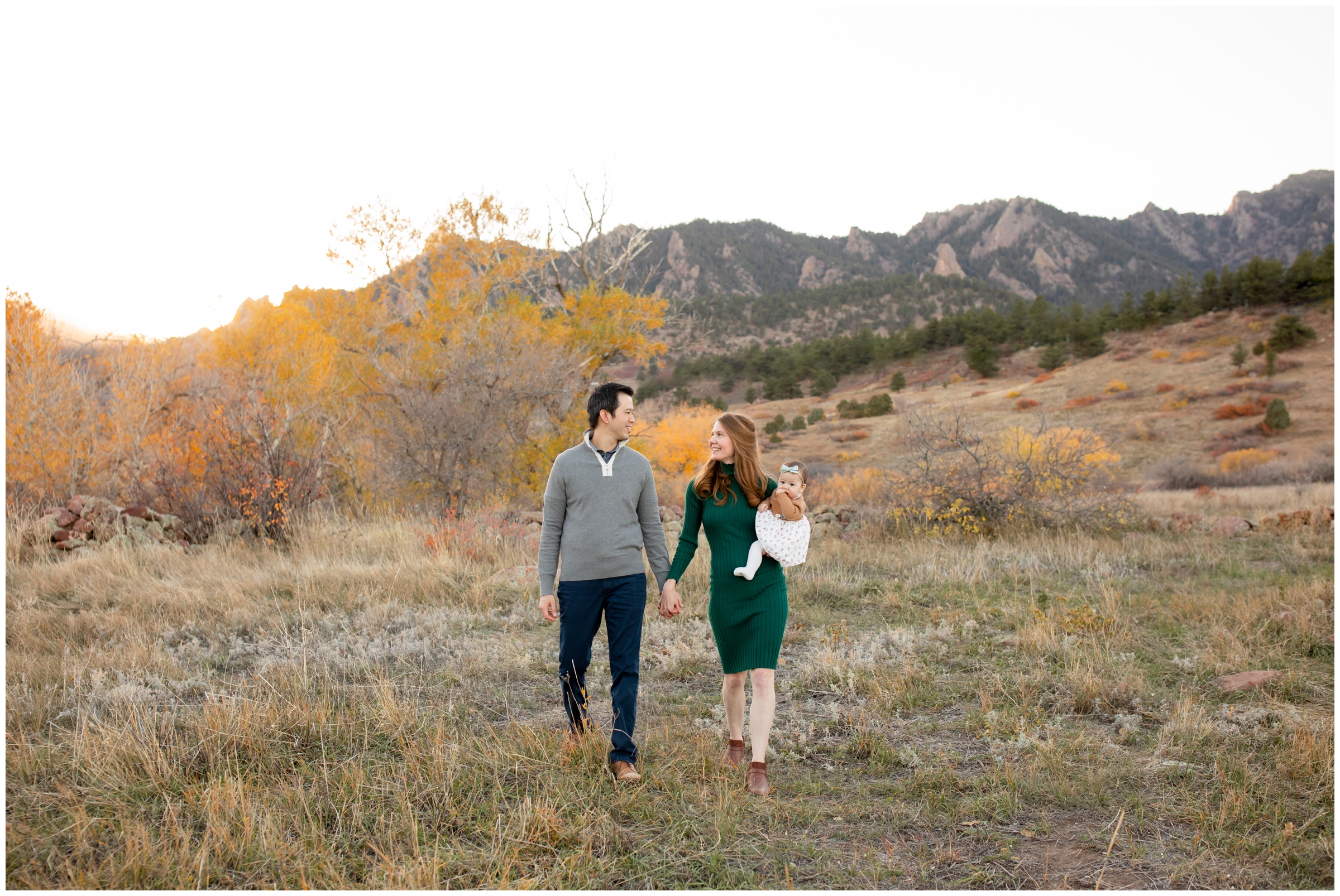 family walking and holding hands during candid family photography inspiration at South Mesa in Boulder Colorado