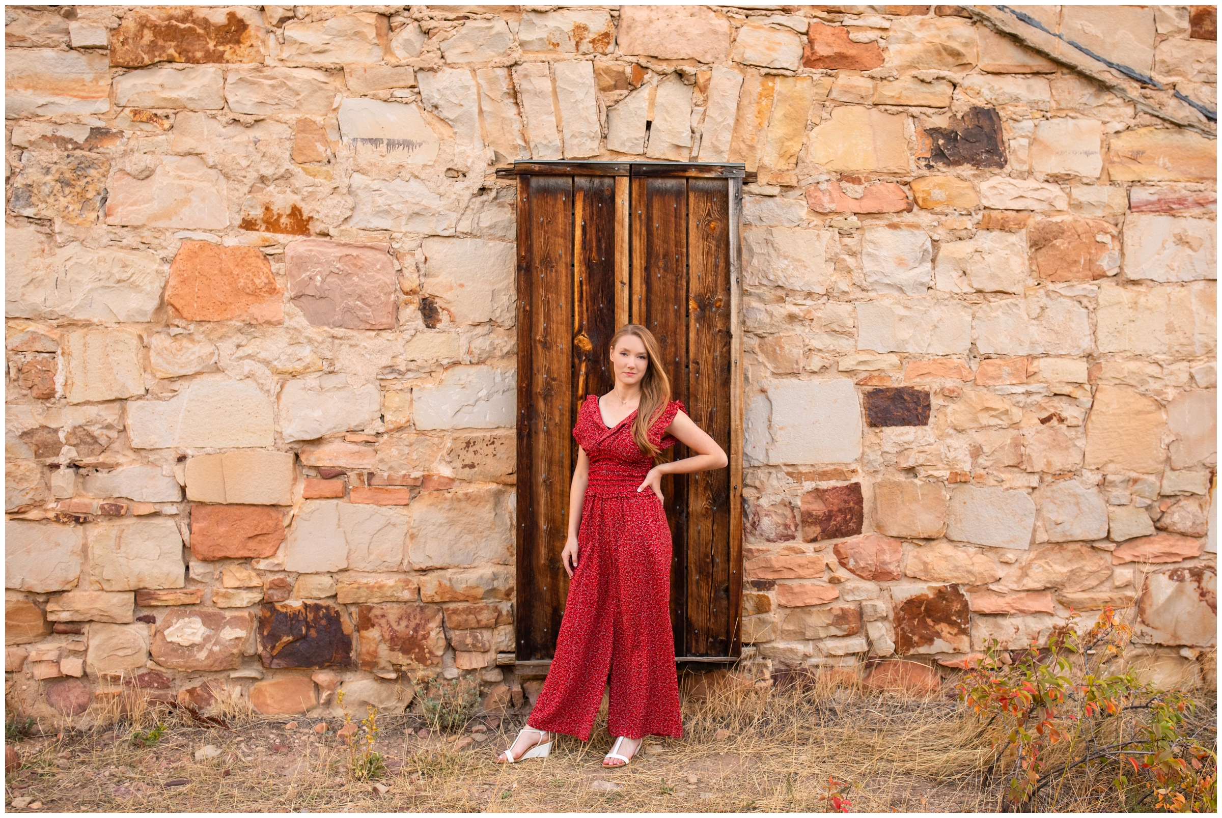 teen girl posing against old wooden door at South Mesa during Boulder senior pictures