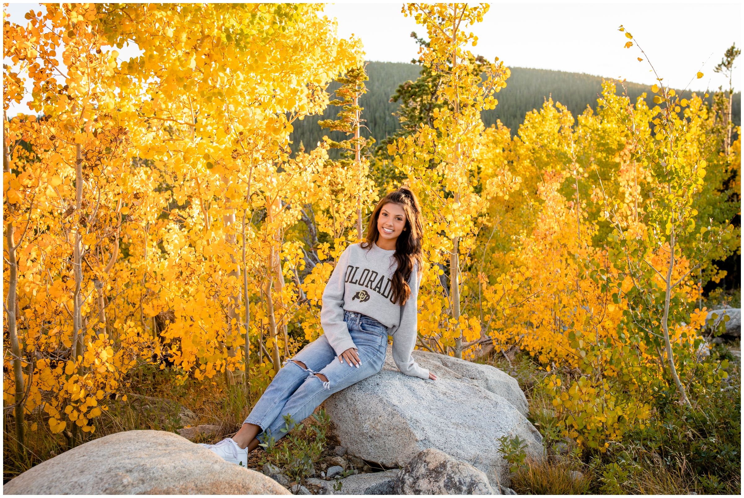 teen posing in an aspen grove in the Colorado mountains during her Mead High school senior portraits 