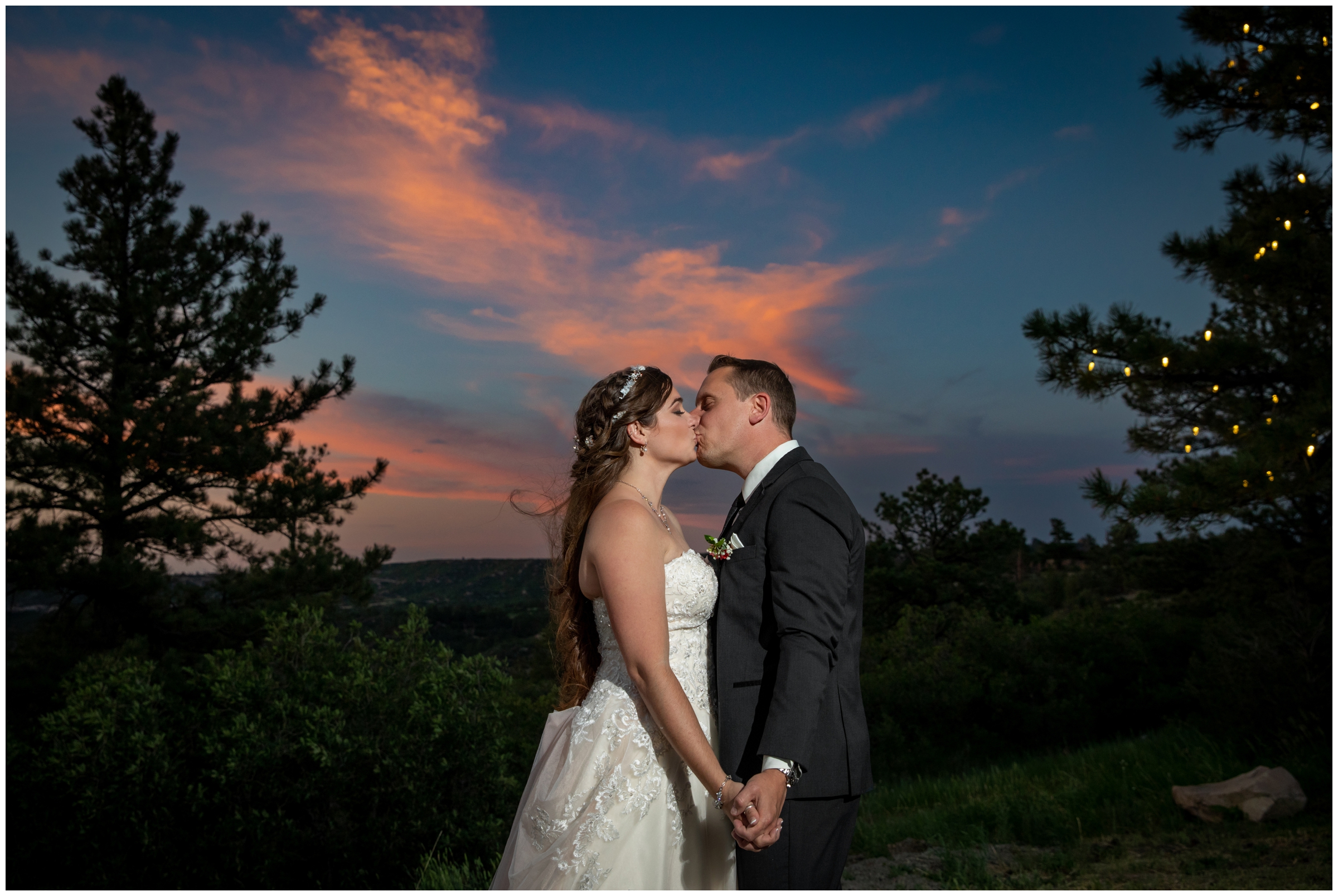 colorful sunset bride and groom portraits at Cherokee Ranch & Castle Colorado wedding 