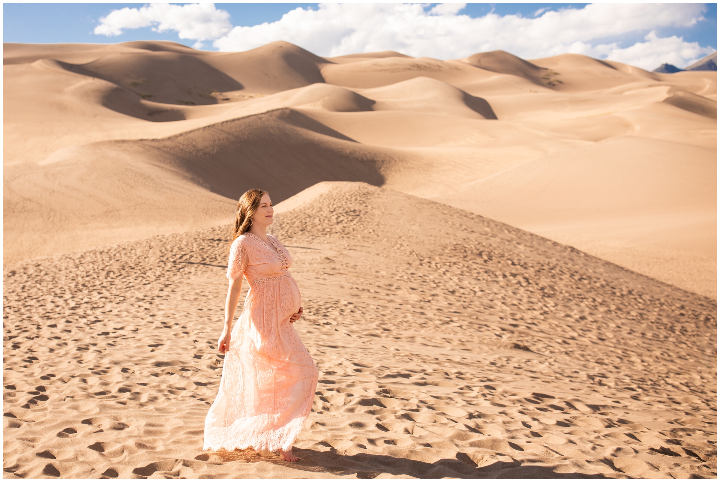 pregnant woman posing at Great Sand Dunes National Park 