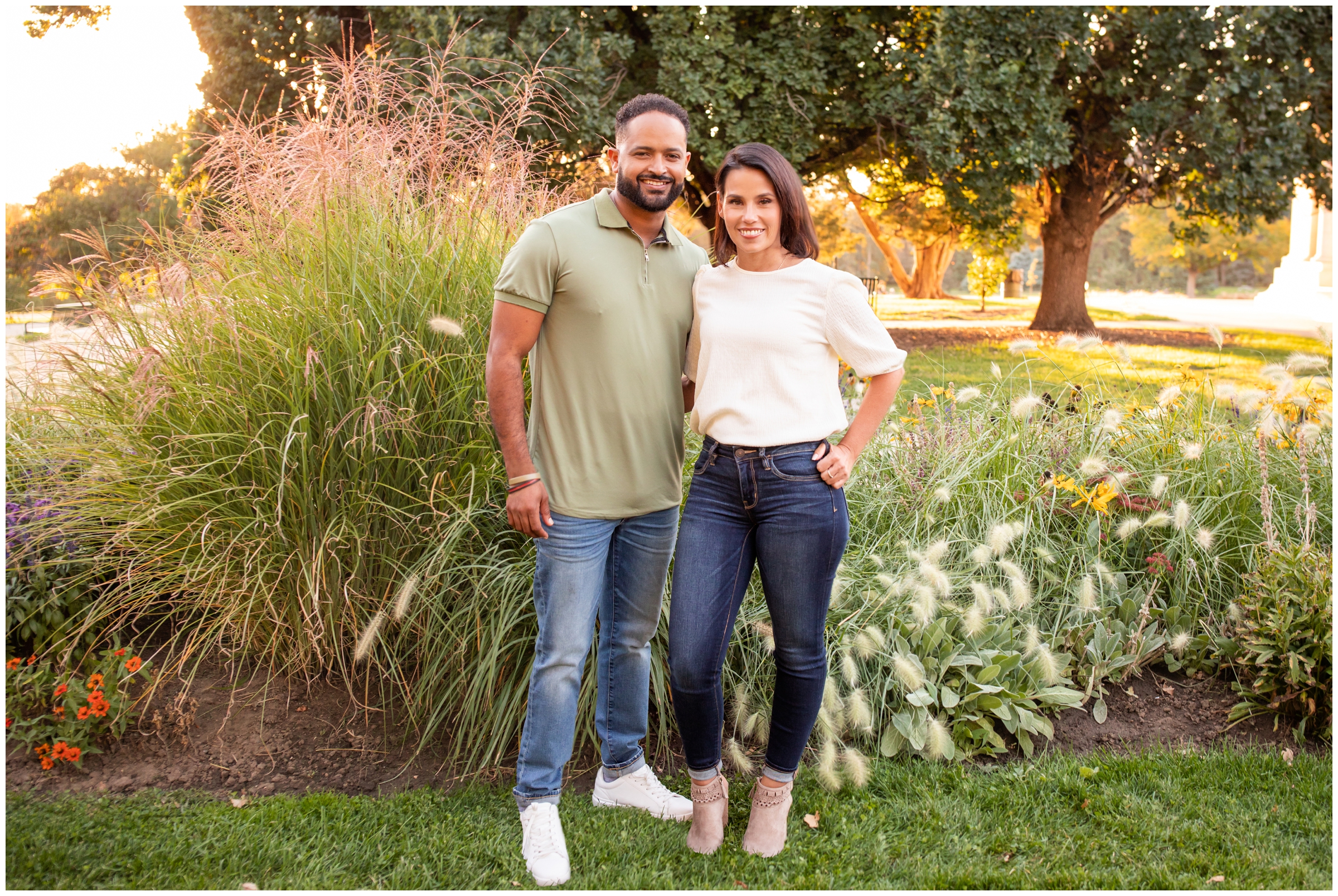 couple posing in flower gardens at Cheesman Park Denver during anniversary photos 