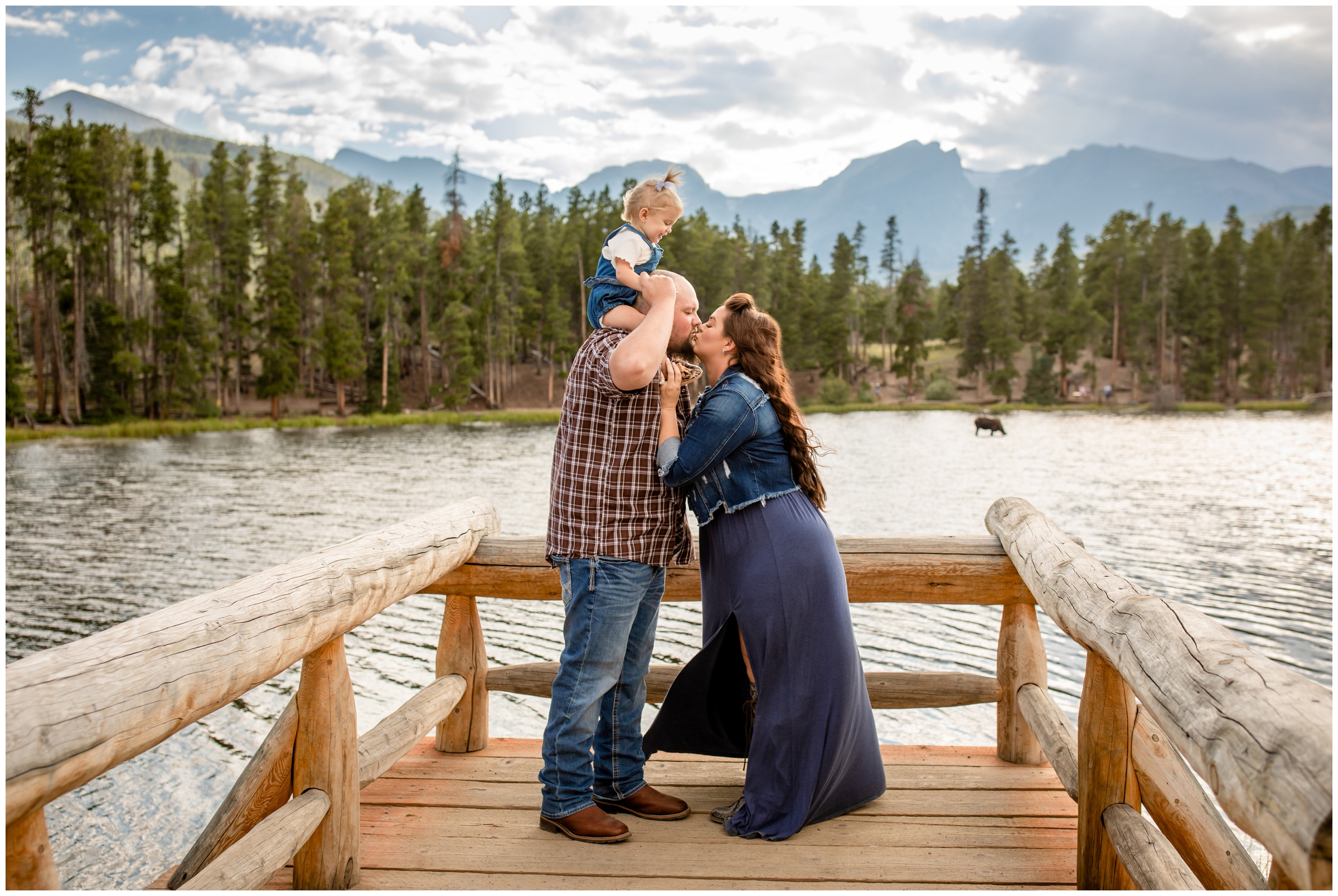 family posing on dock at Sprague Lake during Colorado portrait photography session in Estes Park