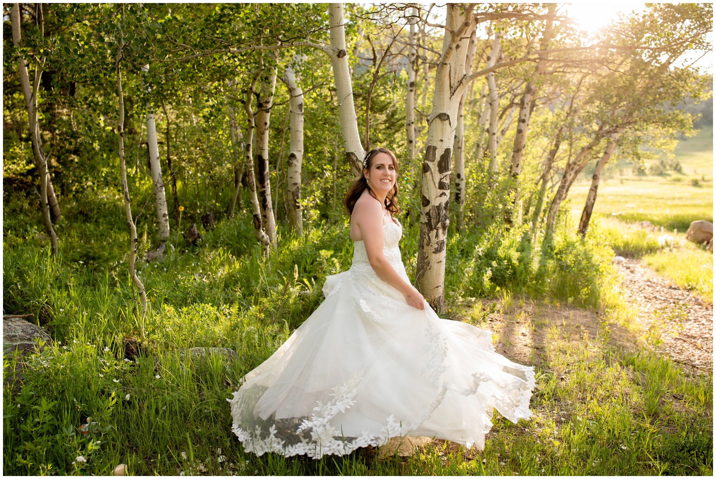 bride spinning in dress in aspen grove during Estes Park wedding photos at Hermit Park 