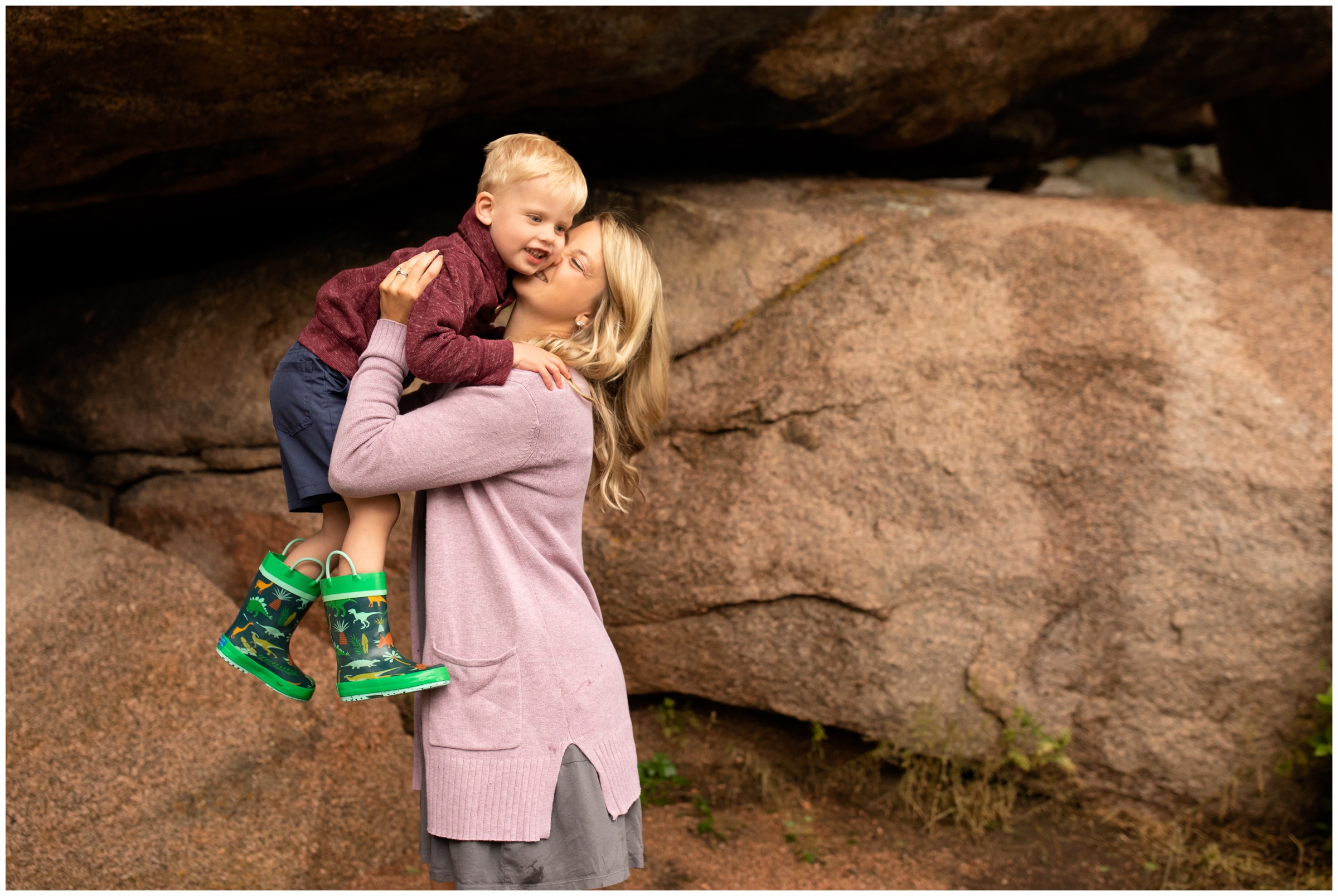 mom kissing son during candid family photography session in Laramie