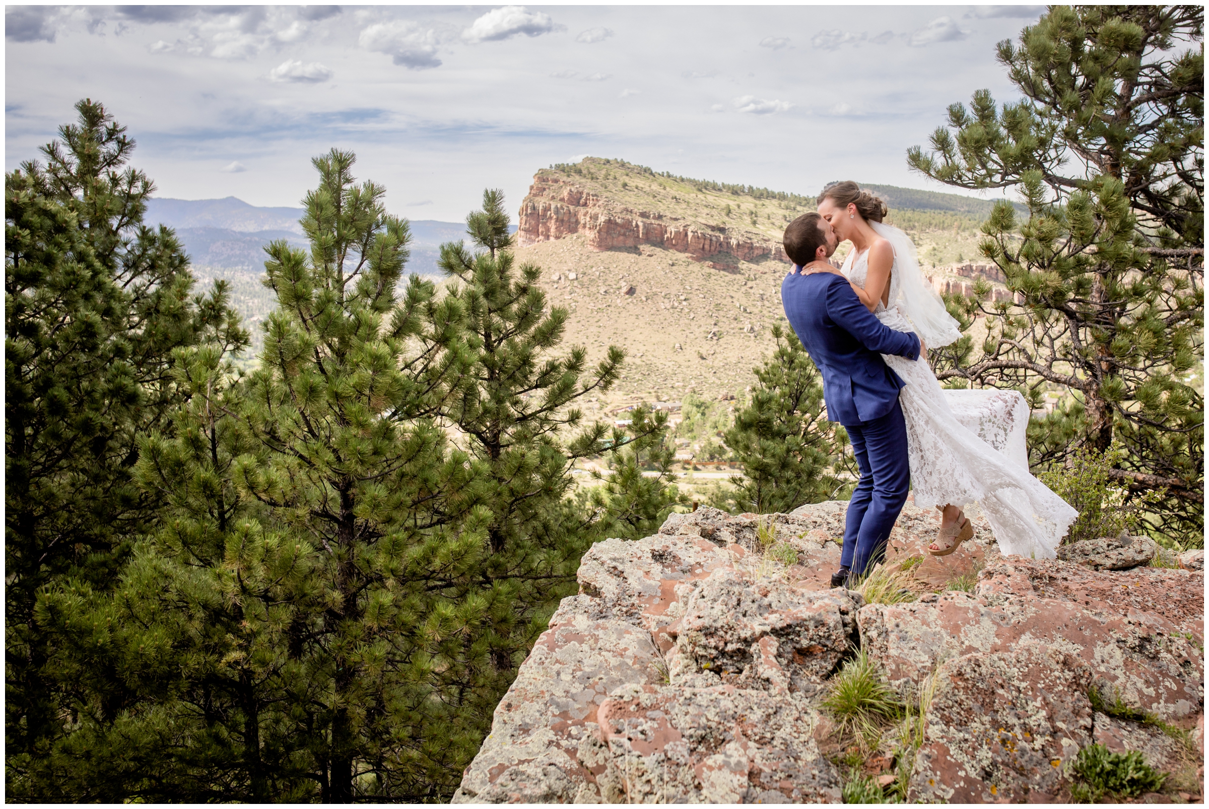 groom lifting bride in the air during mountain wedding pictures at Lionscrest Manor in Colorado
