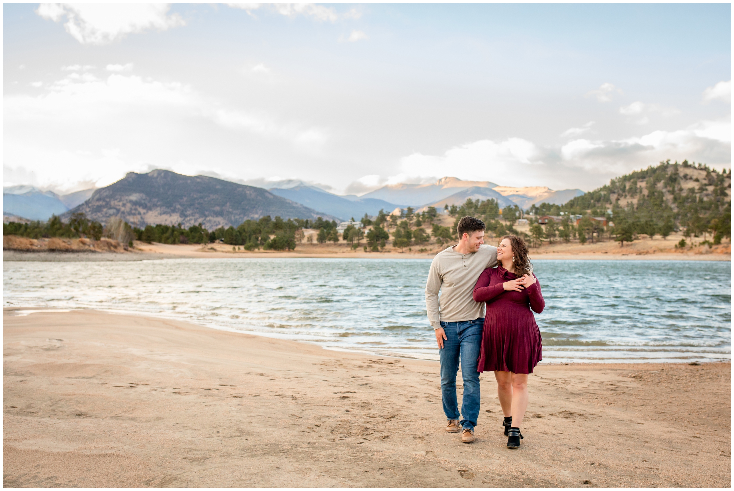 candid engagement photos of couple walking next to Marys Lake in Estes Park 