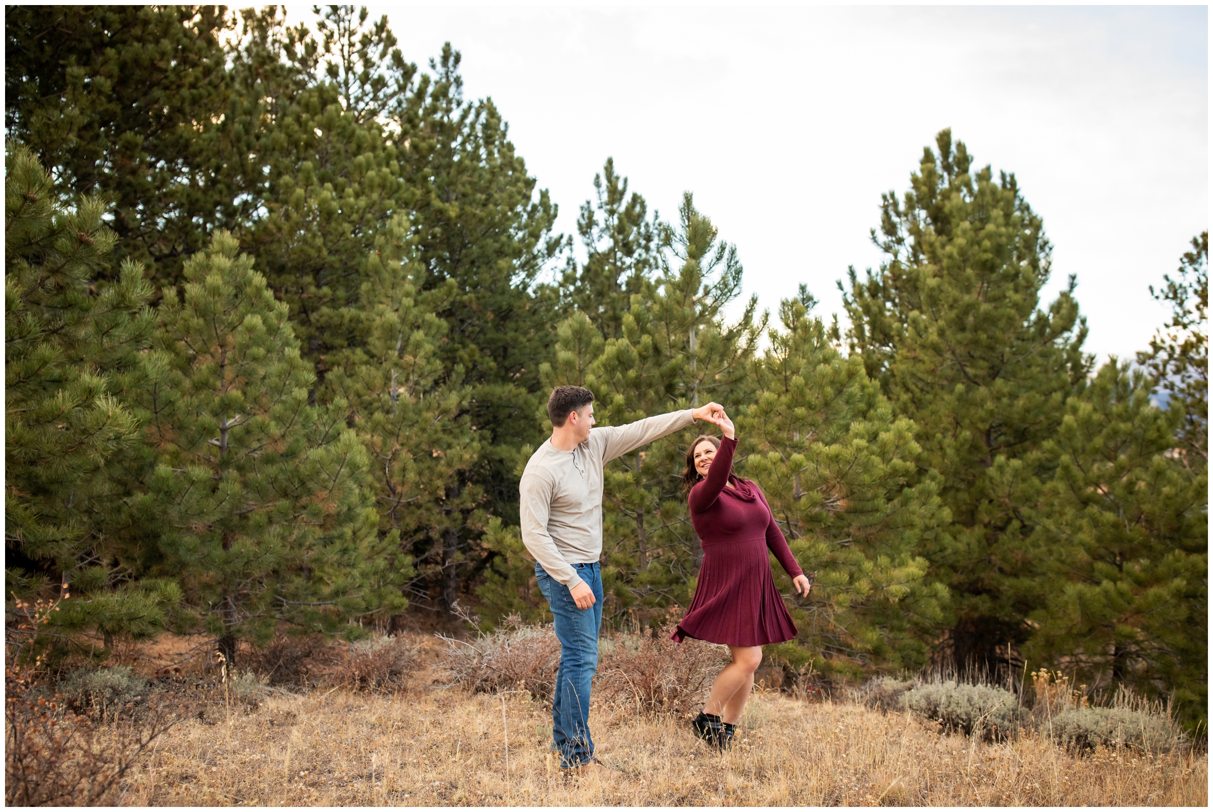 couple dancing in the forest during Estes Park Colorado engagement photography session