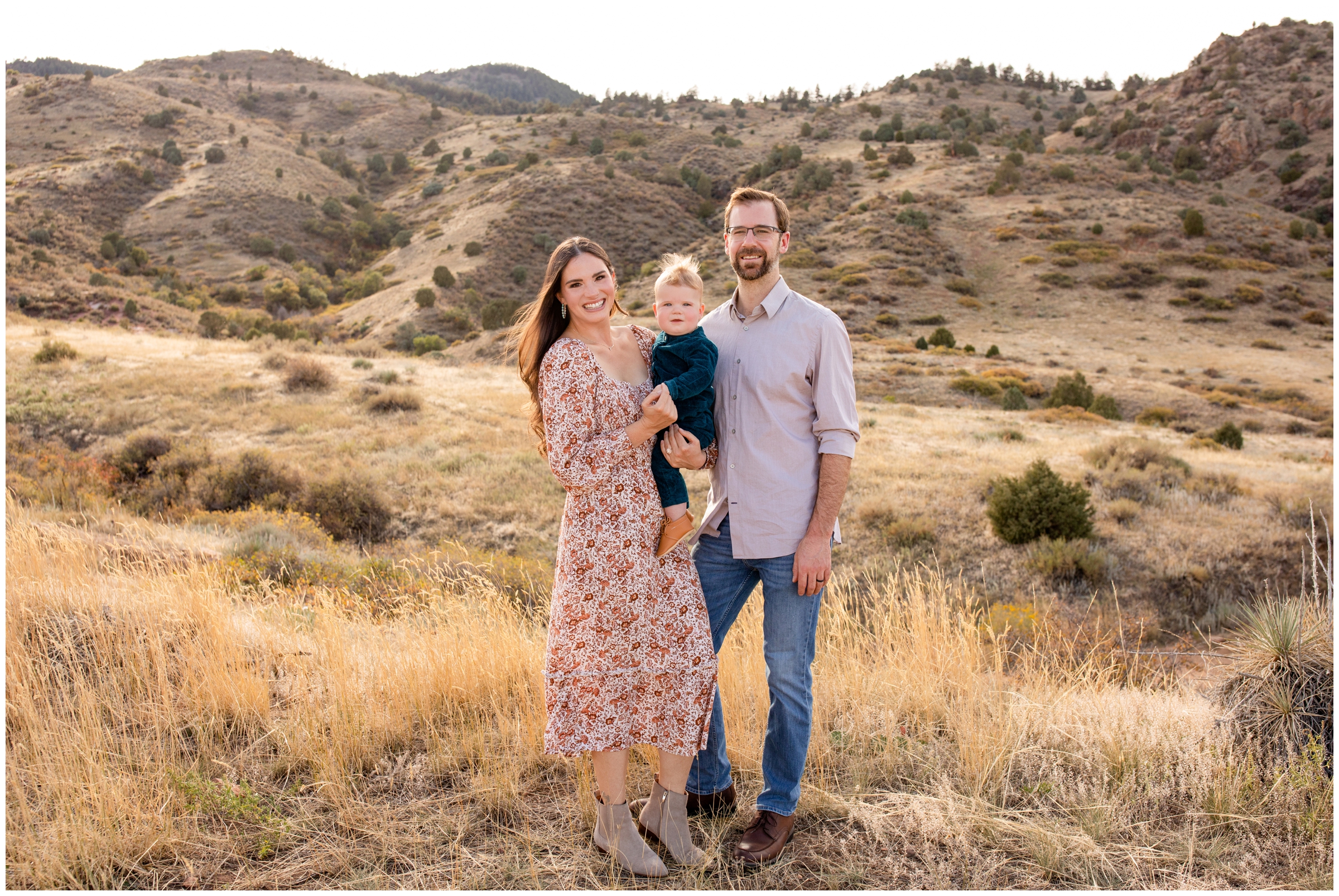 family posing in front of Colorado foothills mountains during Morrison family photos 