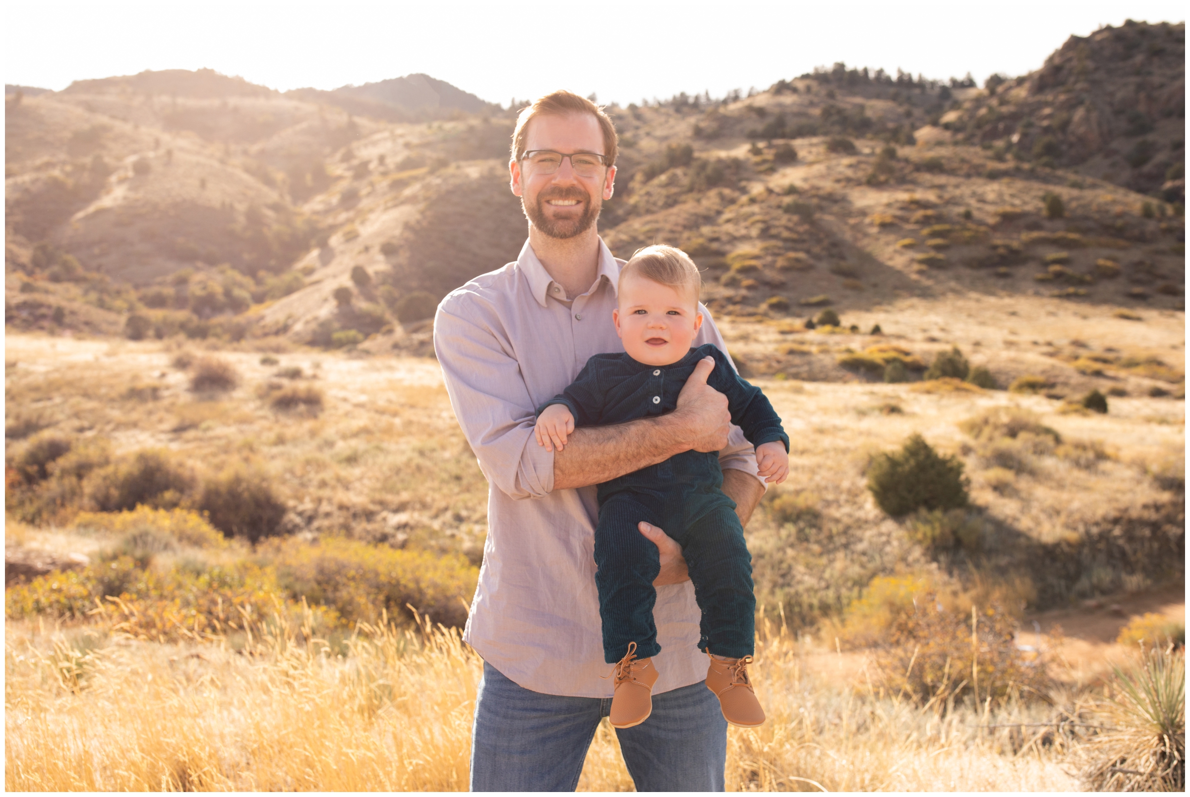 dad holding son during foothills Colorado photography session 