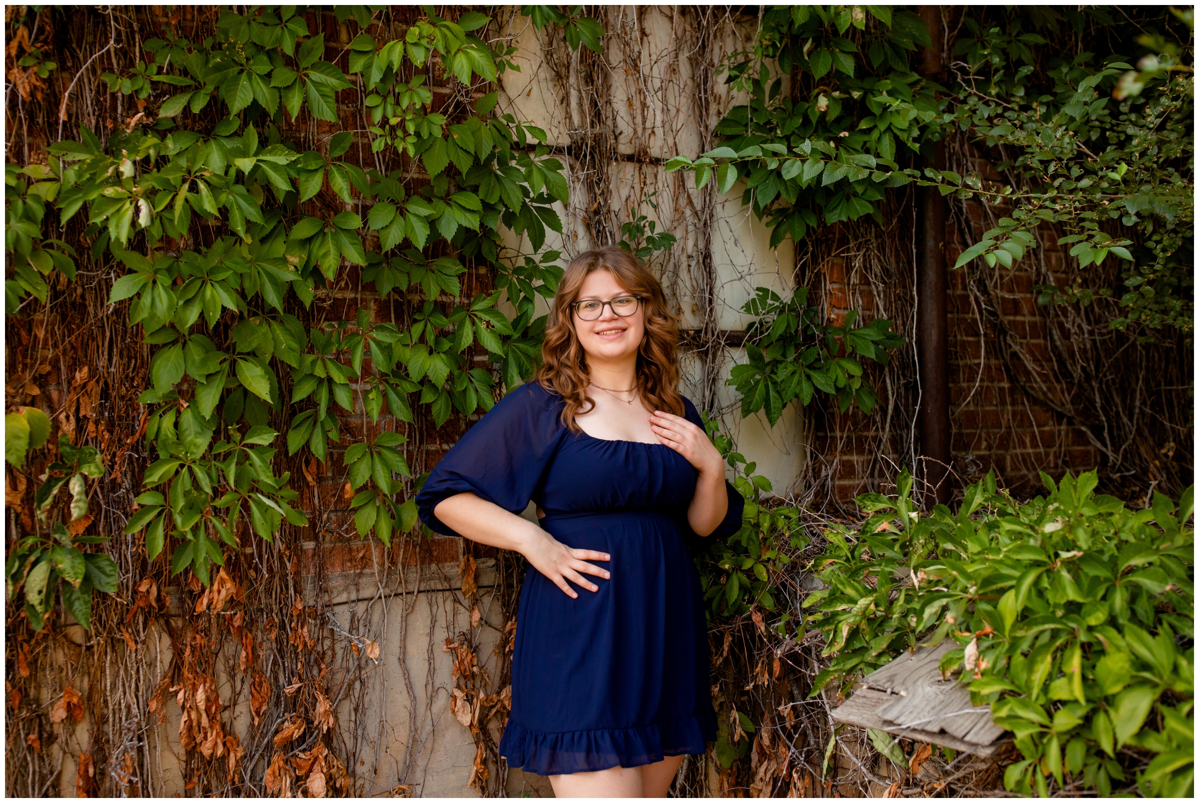 teen girl posing in front of ivy wall during Boulder graduation photography session 