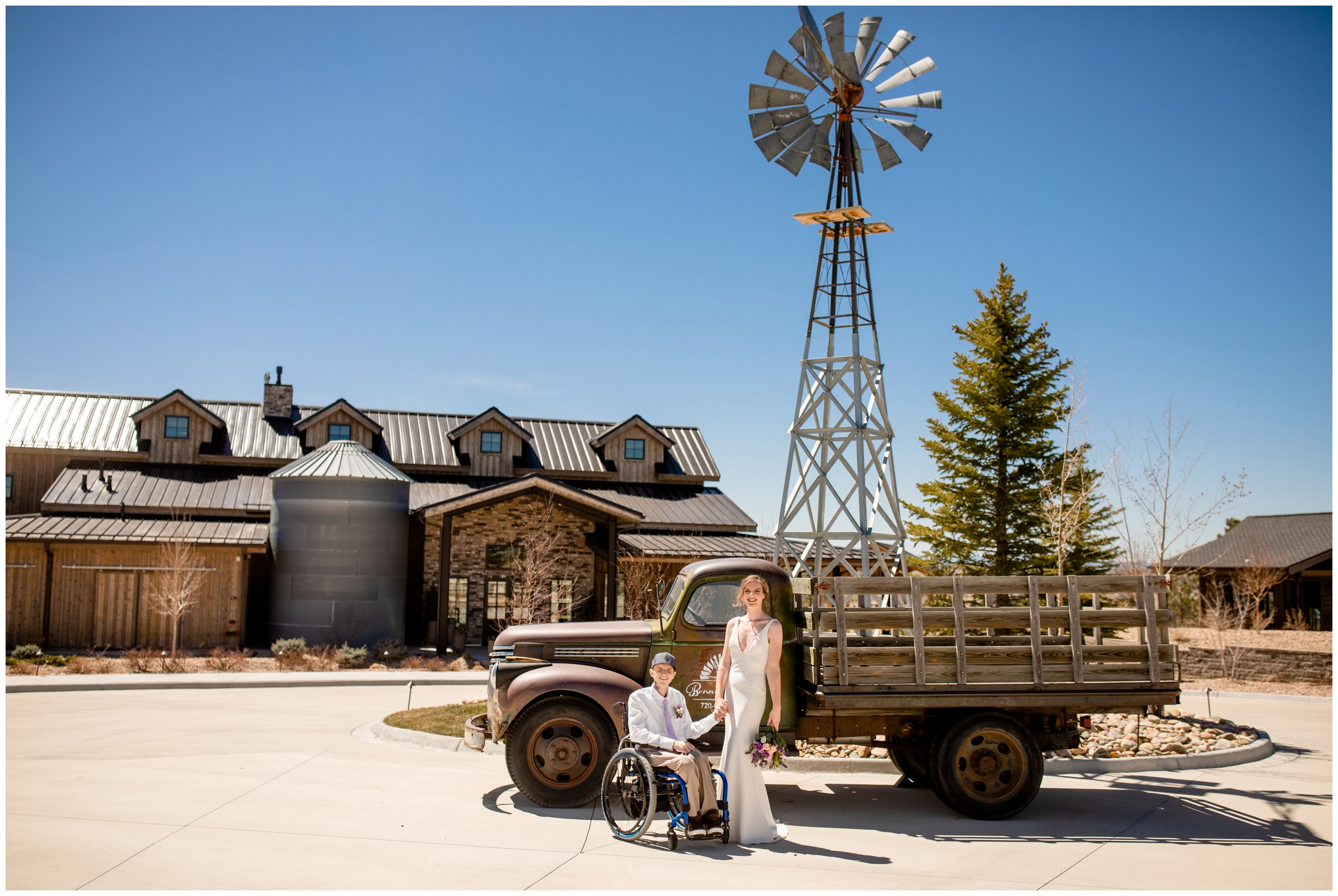 couple posing in front of vintage truck during Bonnie Blues Colorado wedding photos by CO elopement photographer Plum Pretty Photography