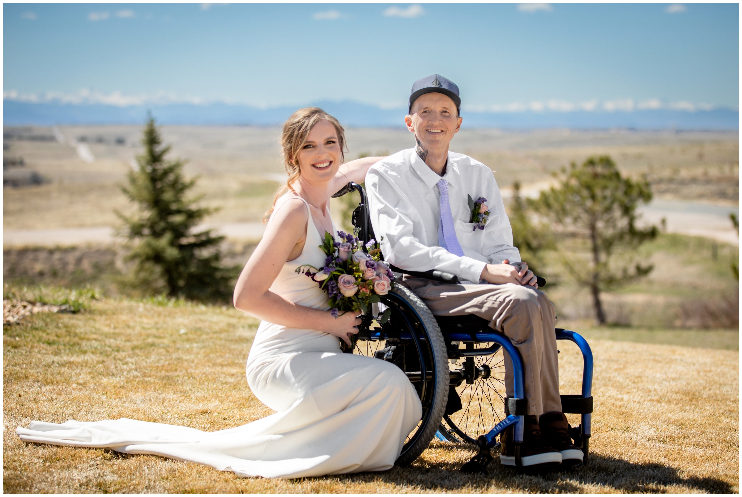 couple posing in front of distant mountain views at Bonnie Blues Colorado wedding photography session