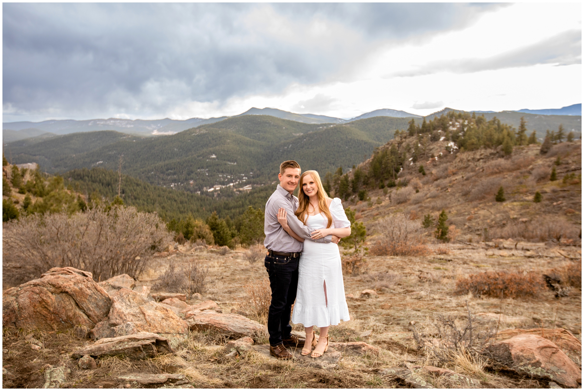couple posing at Mount Falcon West with mountains in background for Colorado couples anniversary photography session 