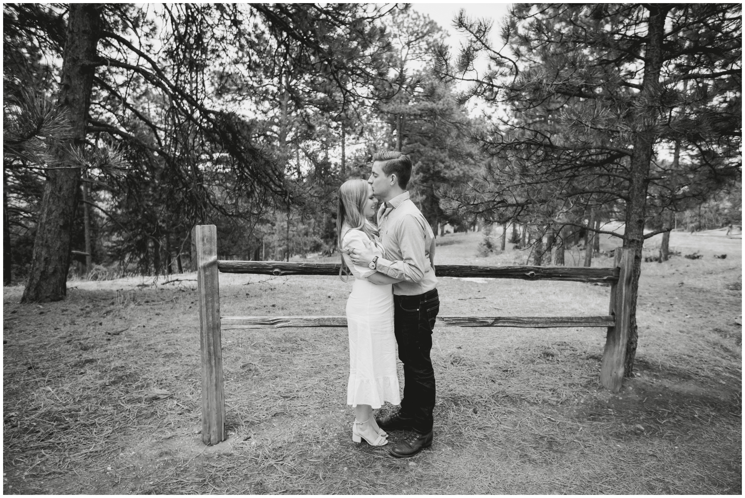 couple posing in a forest during Colorado anniversary portraits in the mountains 