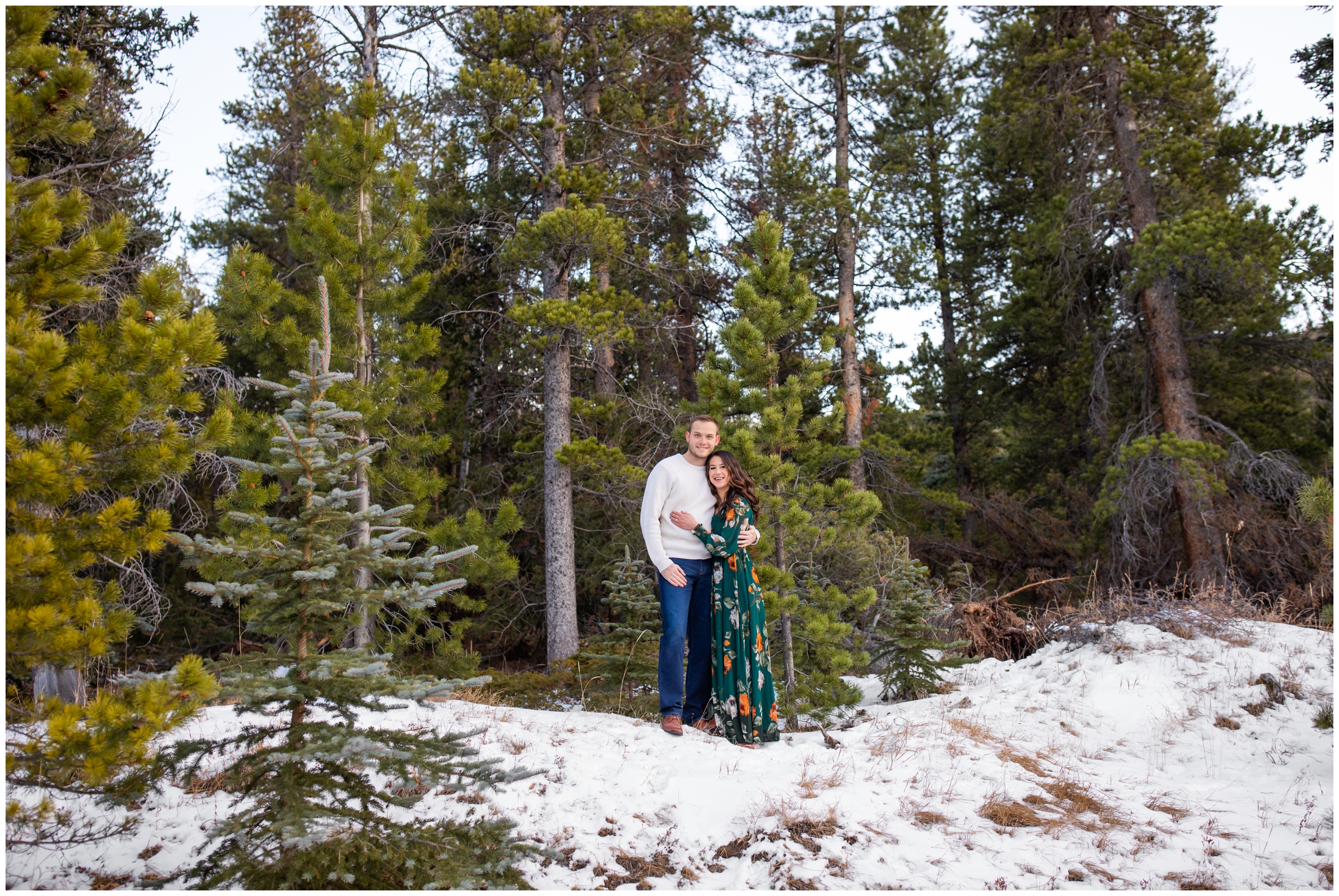 snowy mountain engagement pictures in Evergreen CO by Plum Pretty Photography