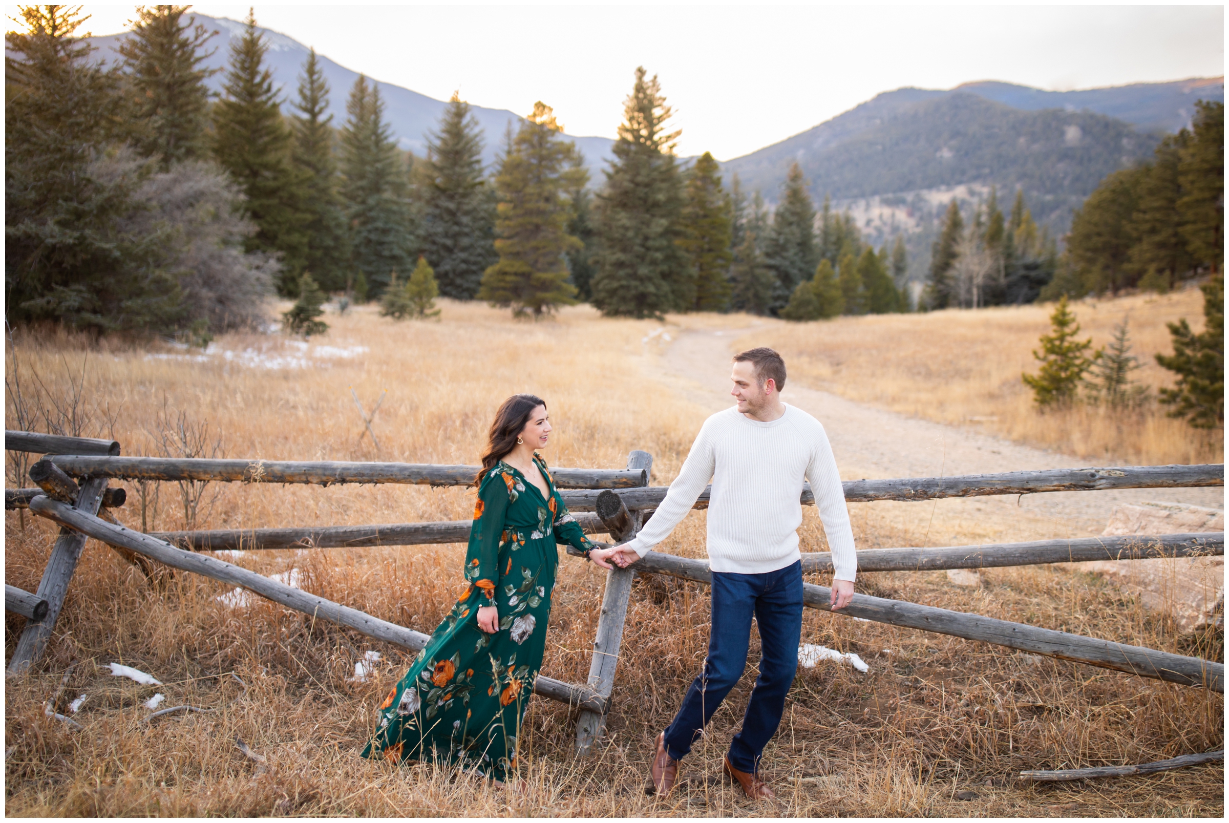 couple holding hands and walking during candid mountain engagement pictures in Evergreen Colorado