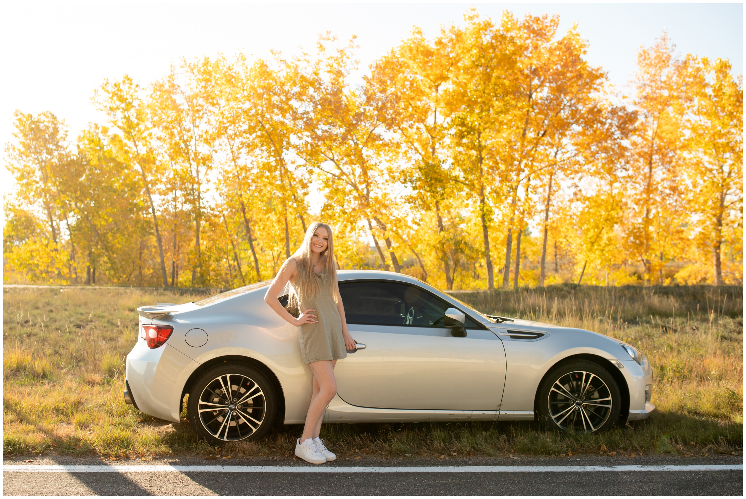 teen girl posing with her car during Longmont graduation photo shoot at Idaho Creek Open Space