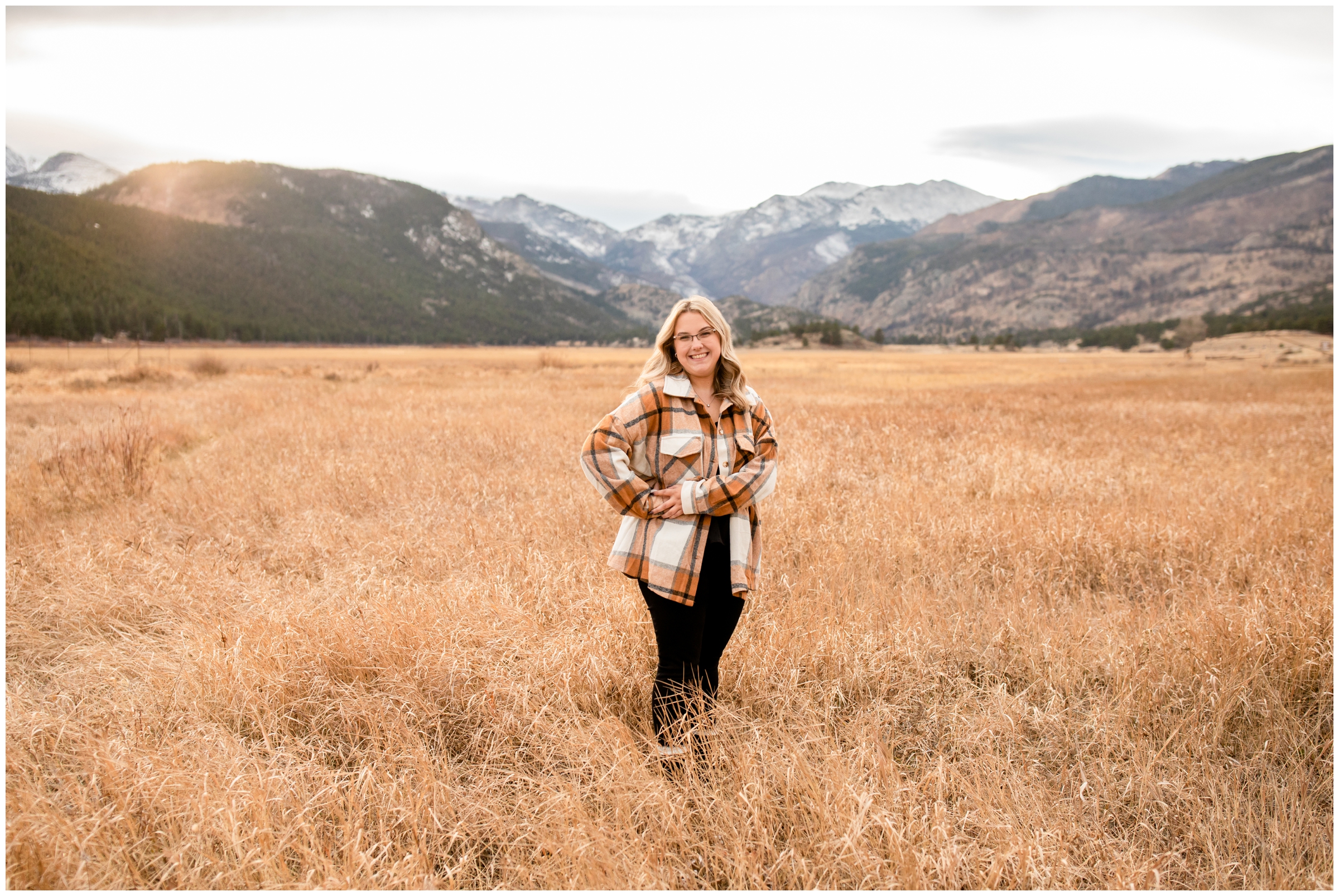 teen posing in field at Moraine Park in RMNP during high school graduation photo session 