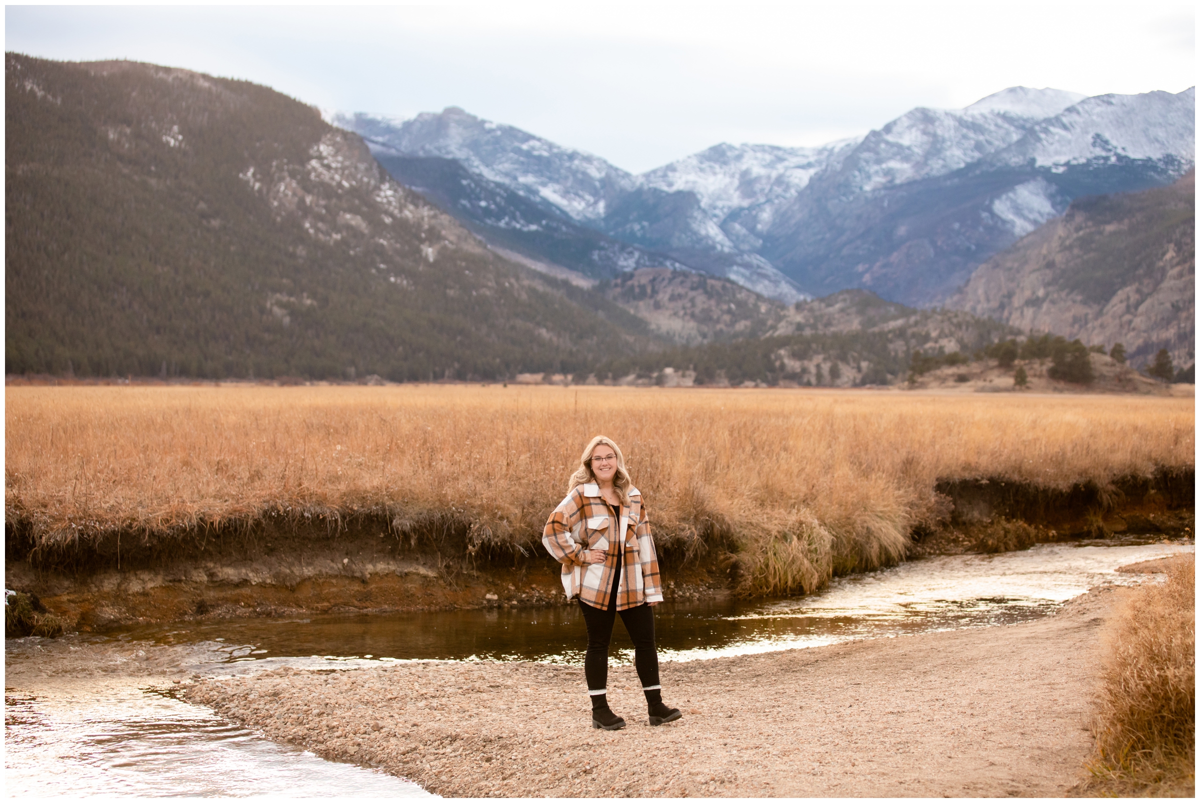 teen posing in front of mountain river in RMNP during senior photos in Colorado 