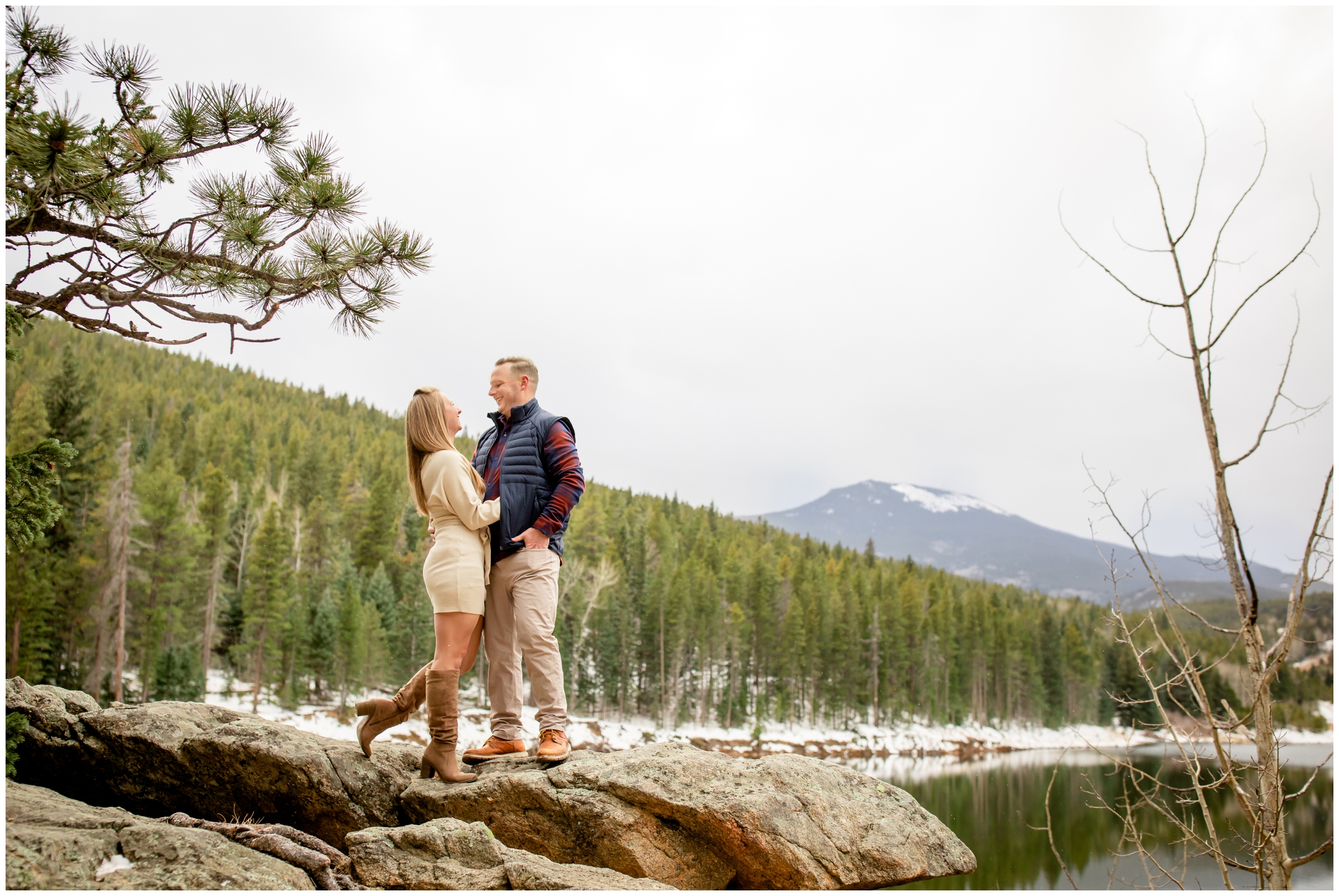 couple posing on rock formations at Beaver Brook Watershed during Evergreen Colorado couples photography session 