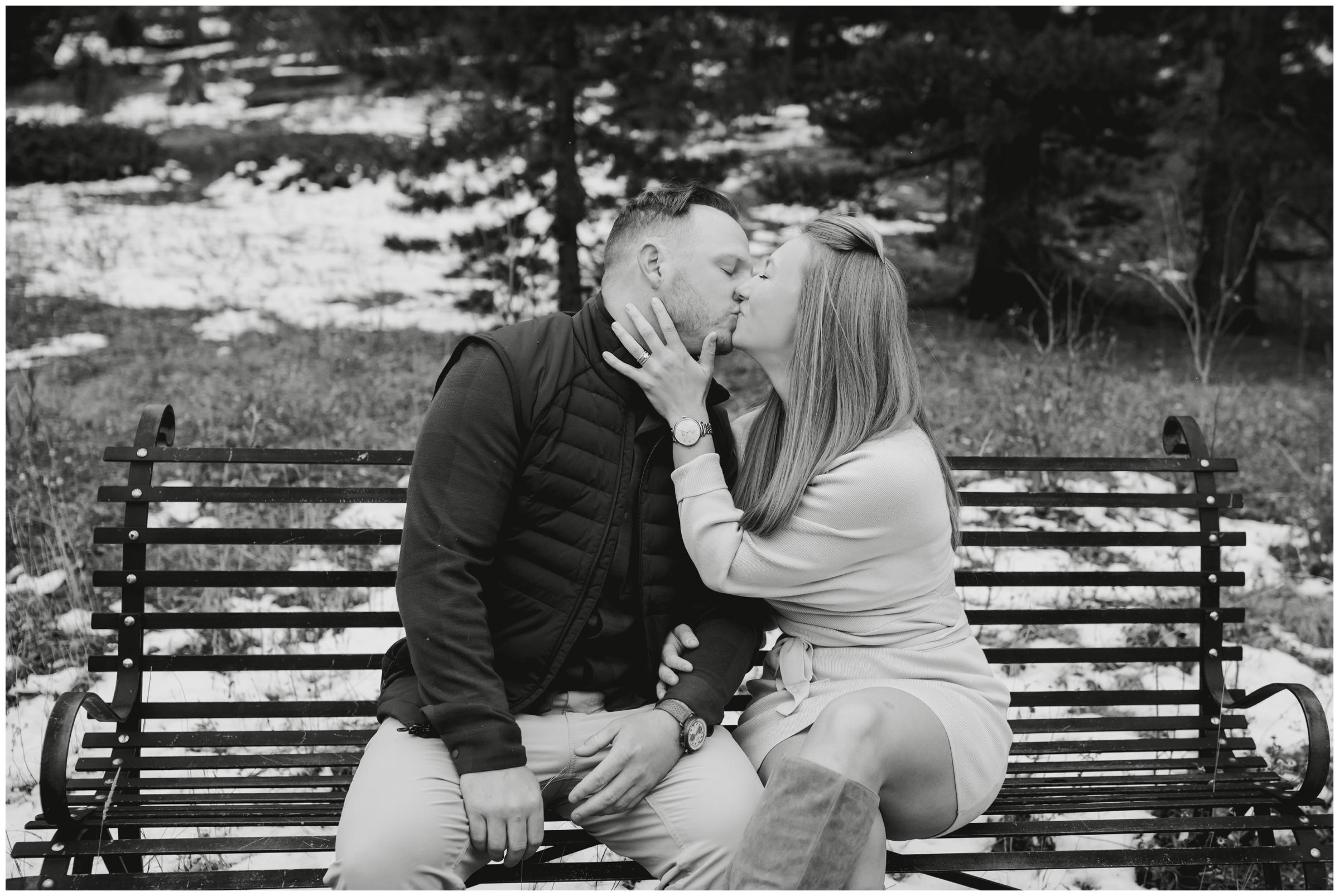 couple kissing on a bench during Evergreen engagement portraits by Plum Pretty Photography 