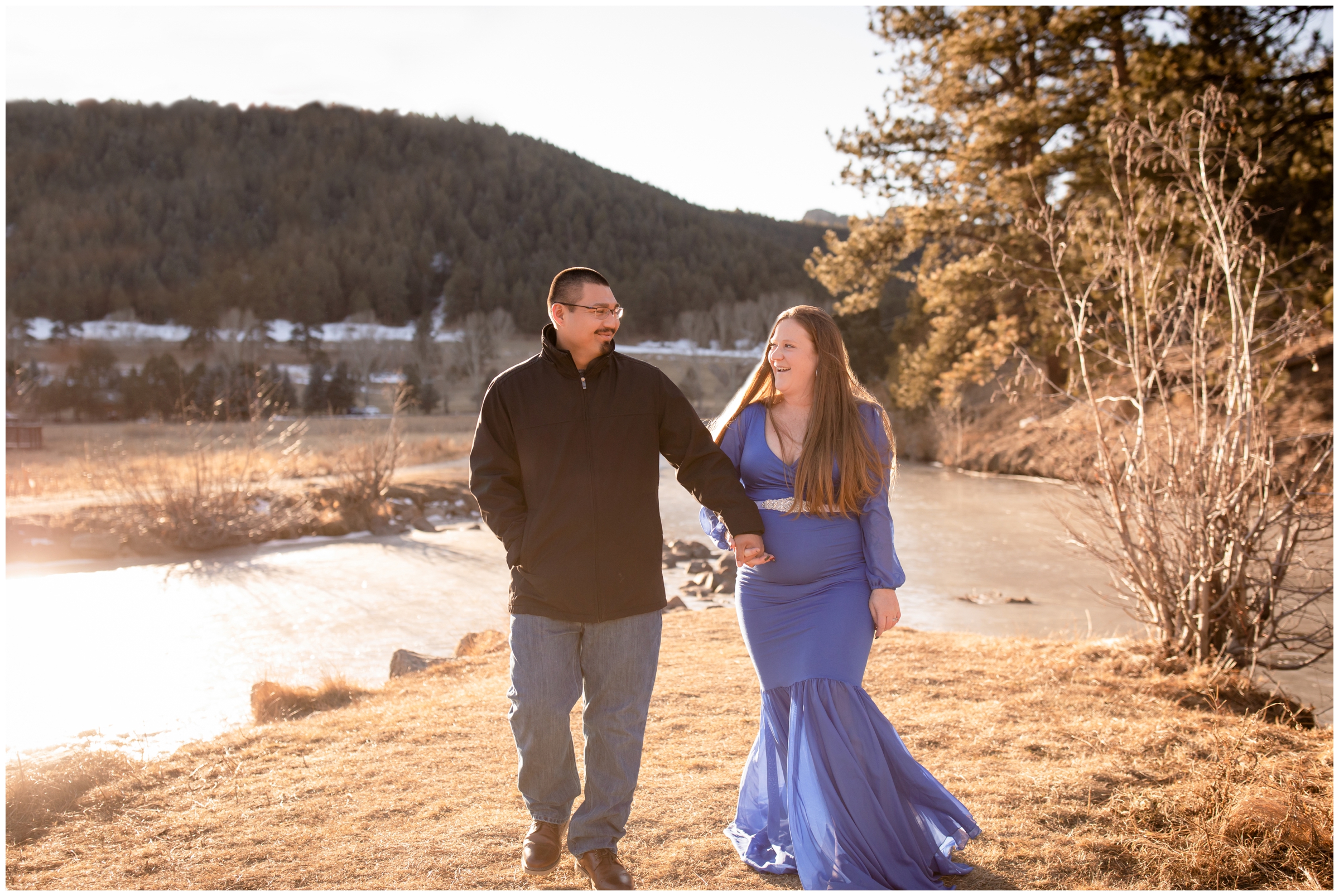 couple holding hands and walking during candid maternity photos in Evergreen Colorado 