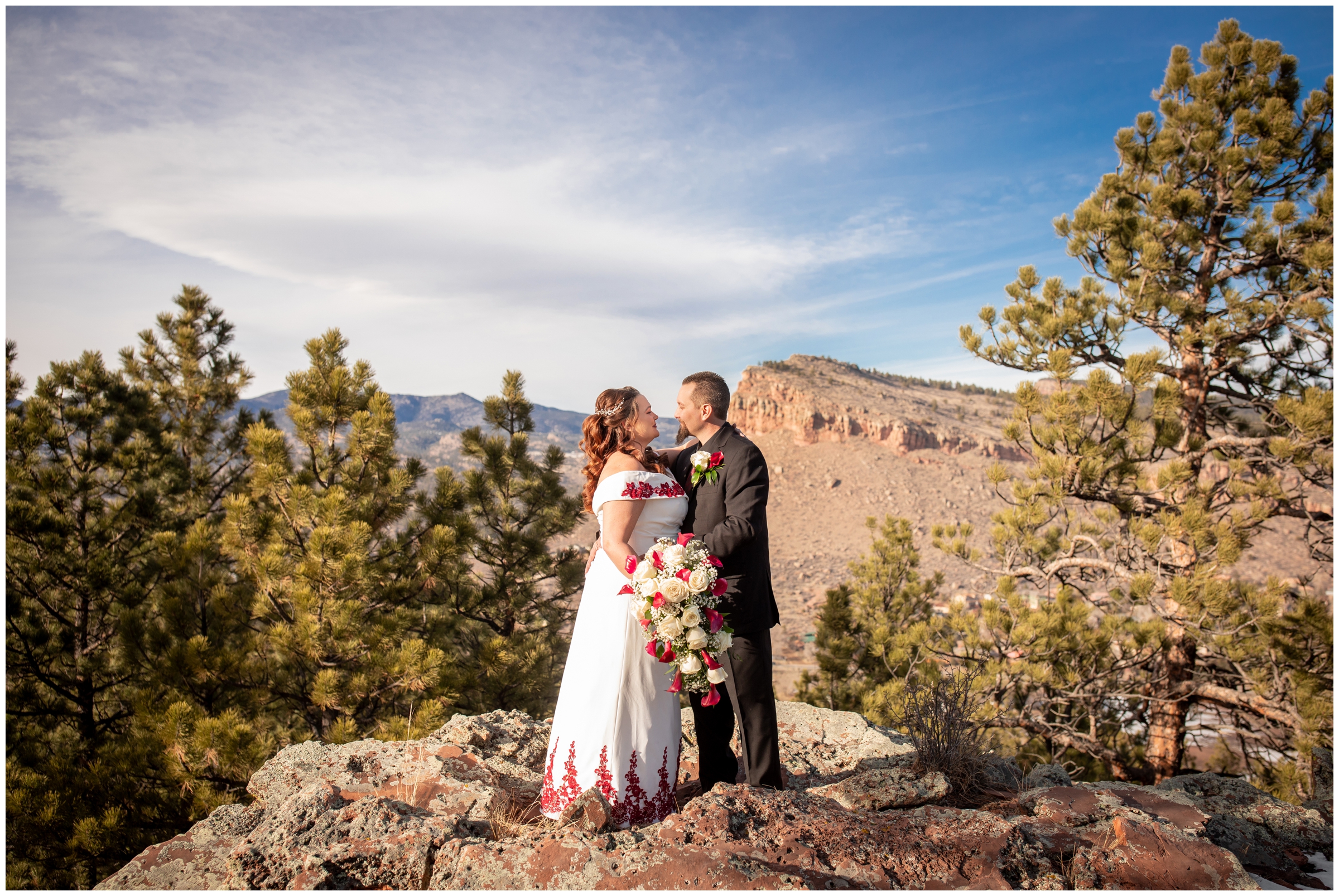 couple posing on top of the mountain during Lionscrest Manor winter wedding portraits by Plum Pretty Photography