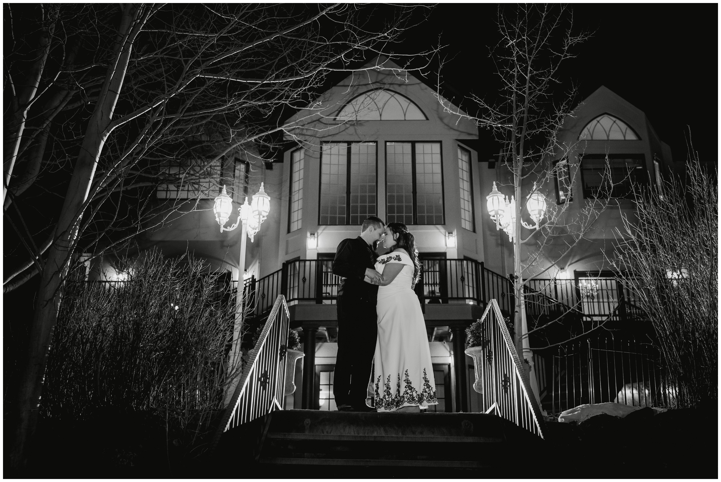 couple posing outside of Lionscrest Manor during nighttime wedding pictures by Plum Pretty Photography 