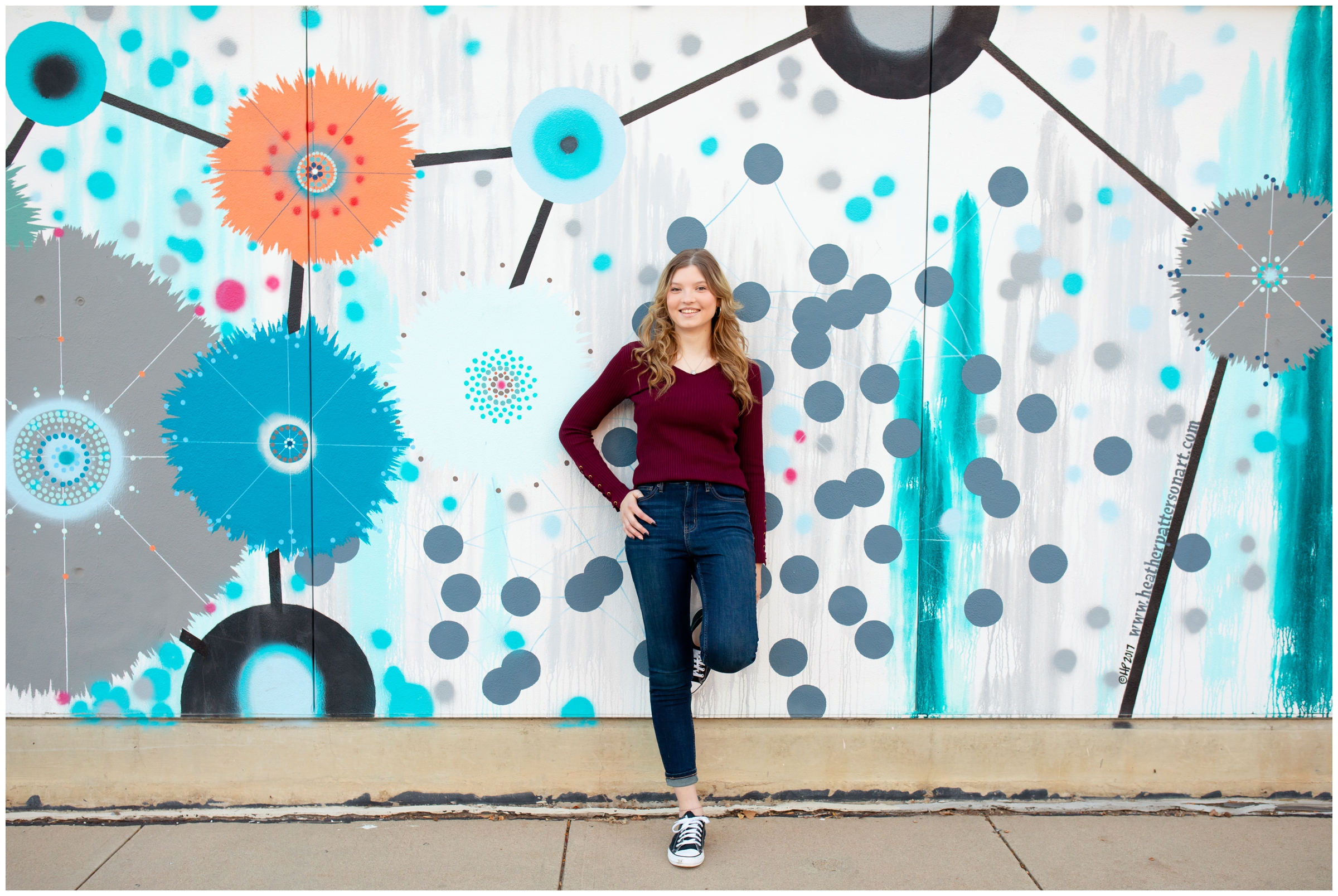 Longmont senior photos at colorful mural wall by Colorado photographer Plum Pretty Photography