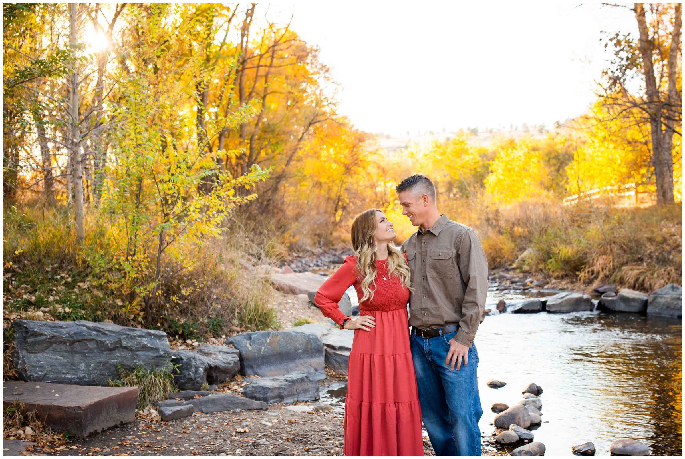 colorful fall engagement pictures next to a river in the Colorado mountains 