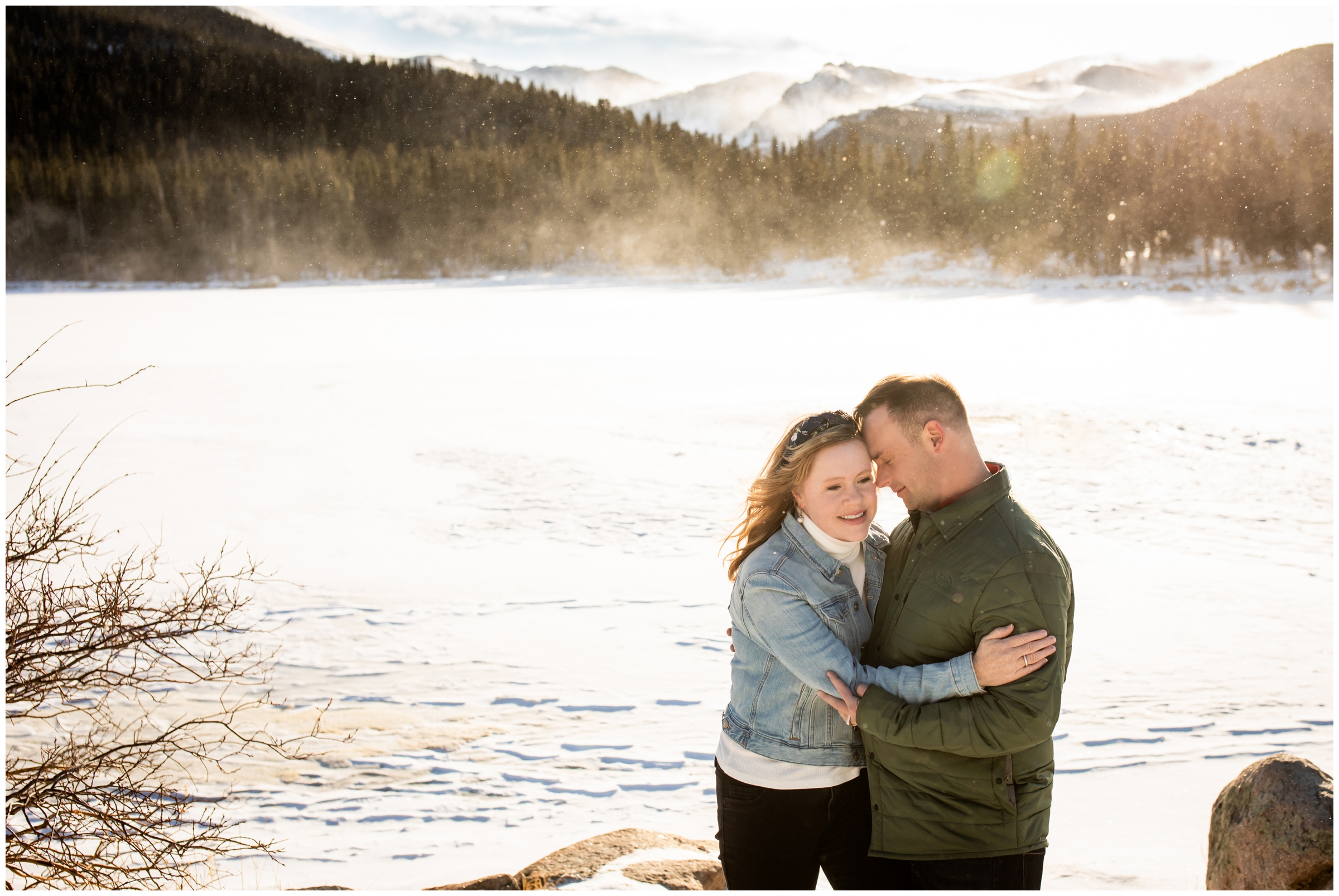 couple cuddling in the snowy colorado mountains at Echo Lake