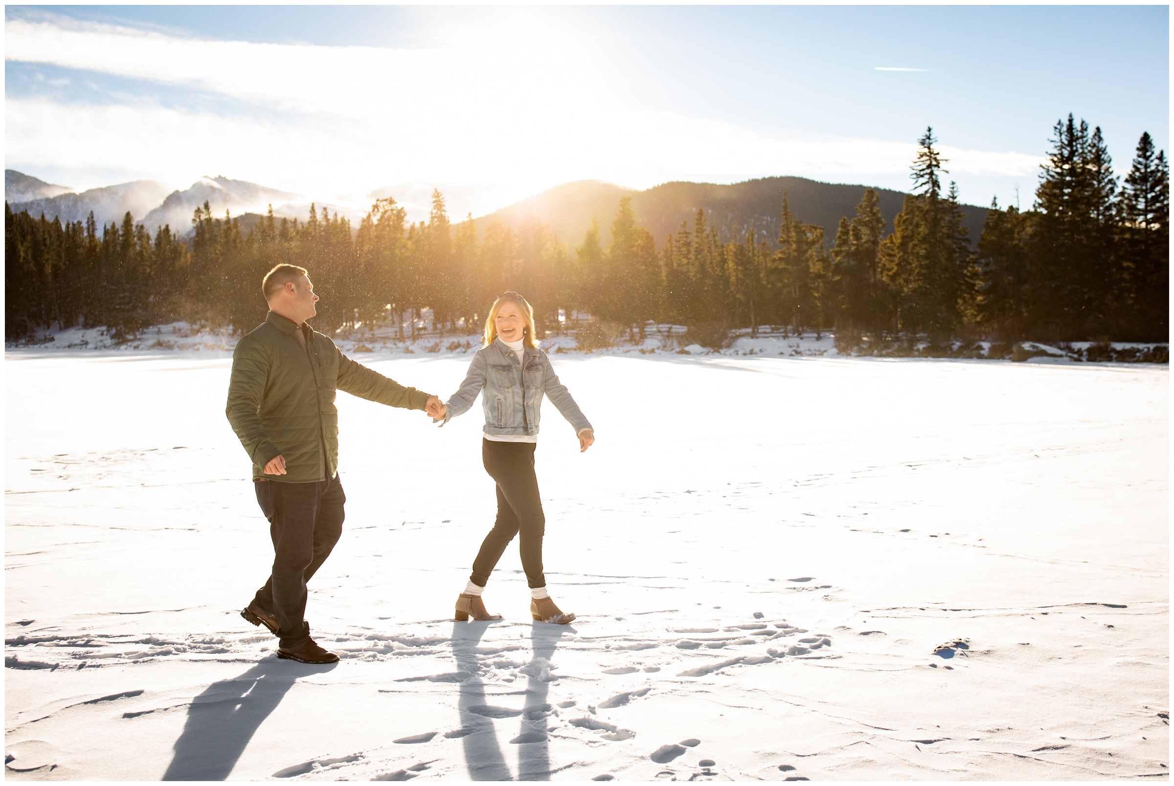 couple walking on frozen lake in colorado mountains during Echo Lake Idaho Springs couples photos 
