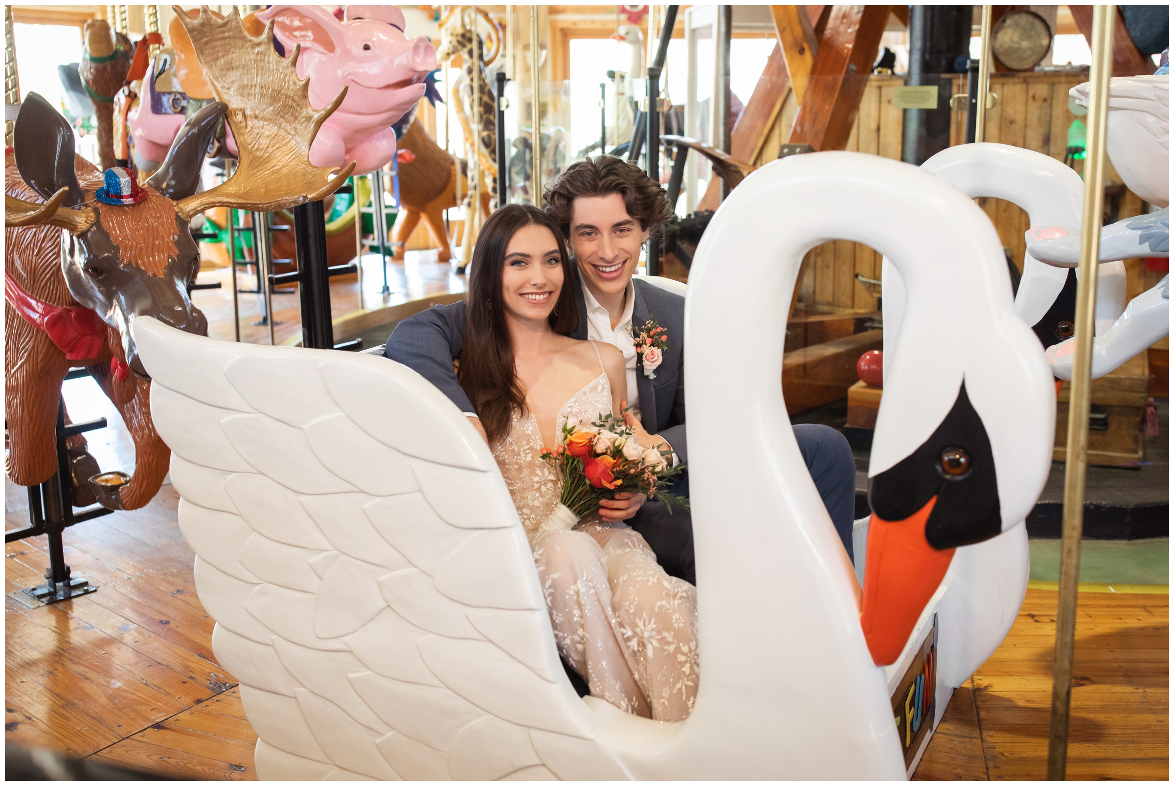 couple sitting on swan bench during carousel elopement wedding photography session in Colorado 