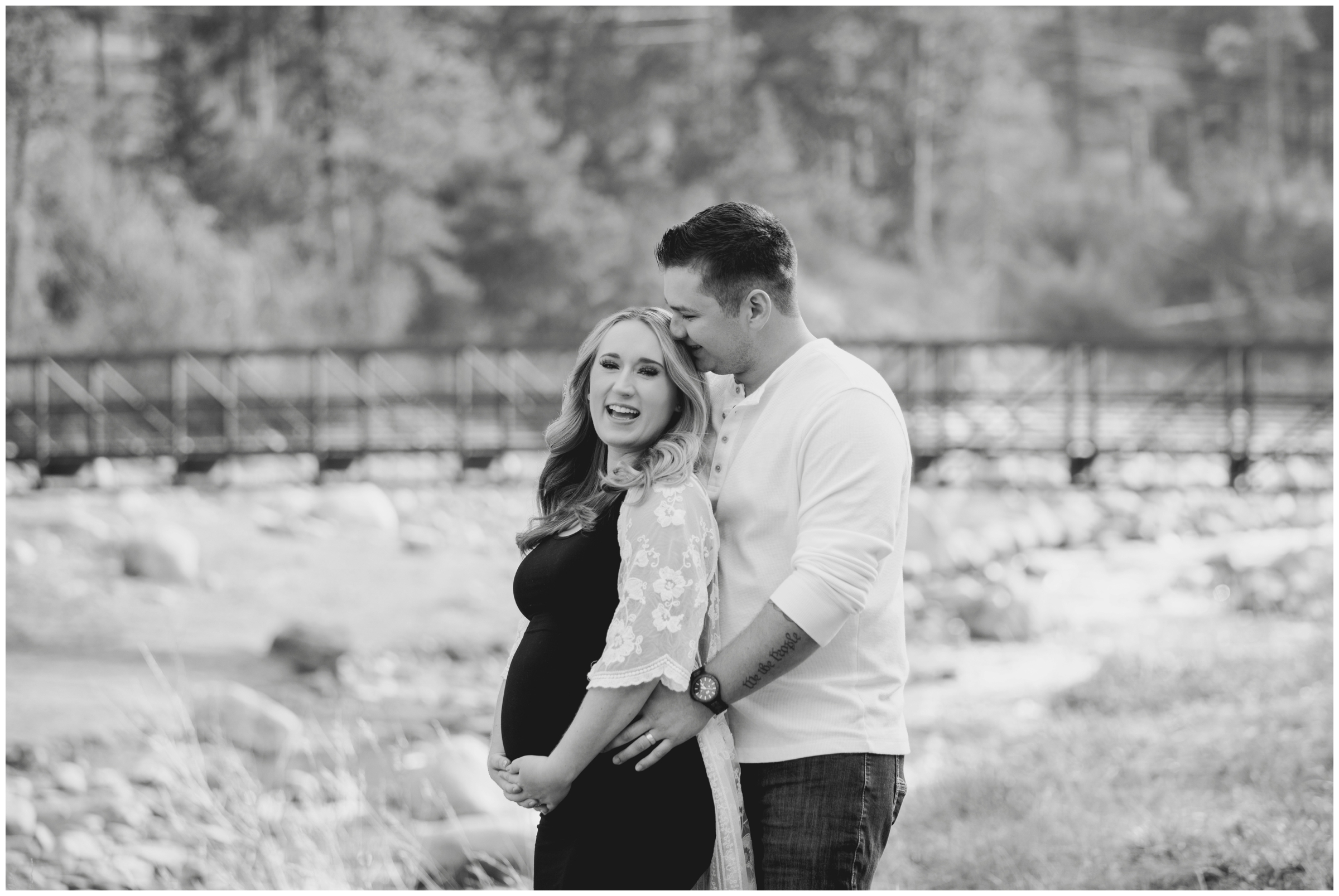 couple embracing during Loveland Colorado maternity pictures by Plum Pretty Photography 